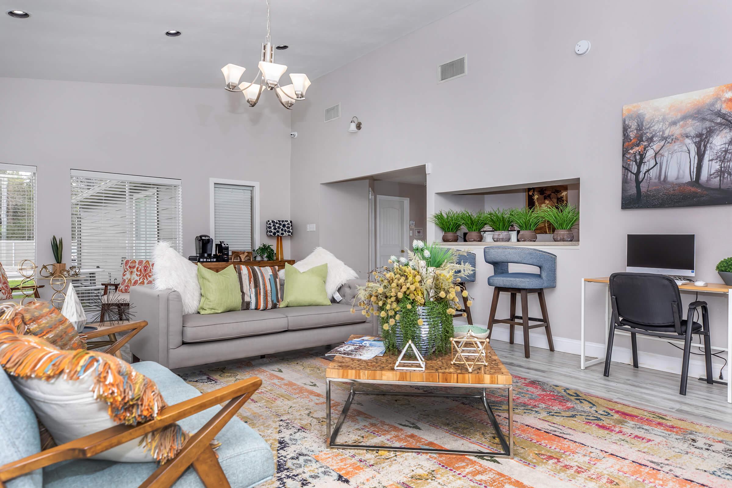 a living room filled with furniture and a fire place