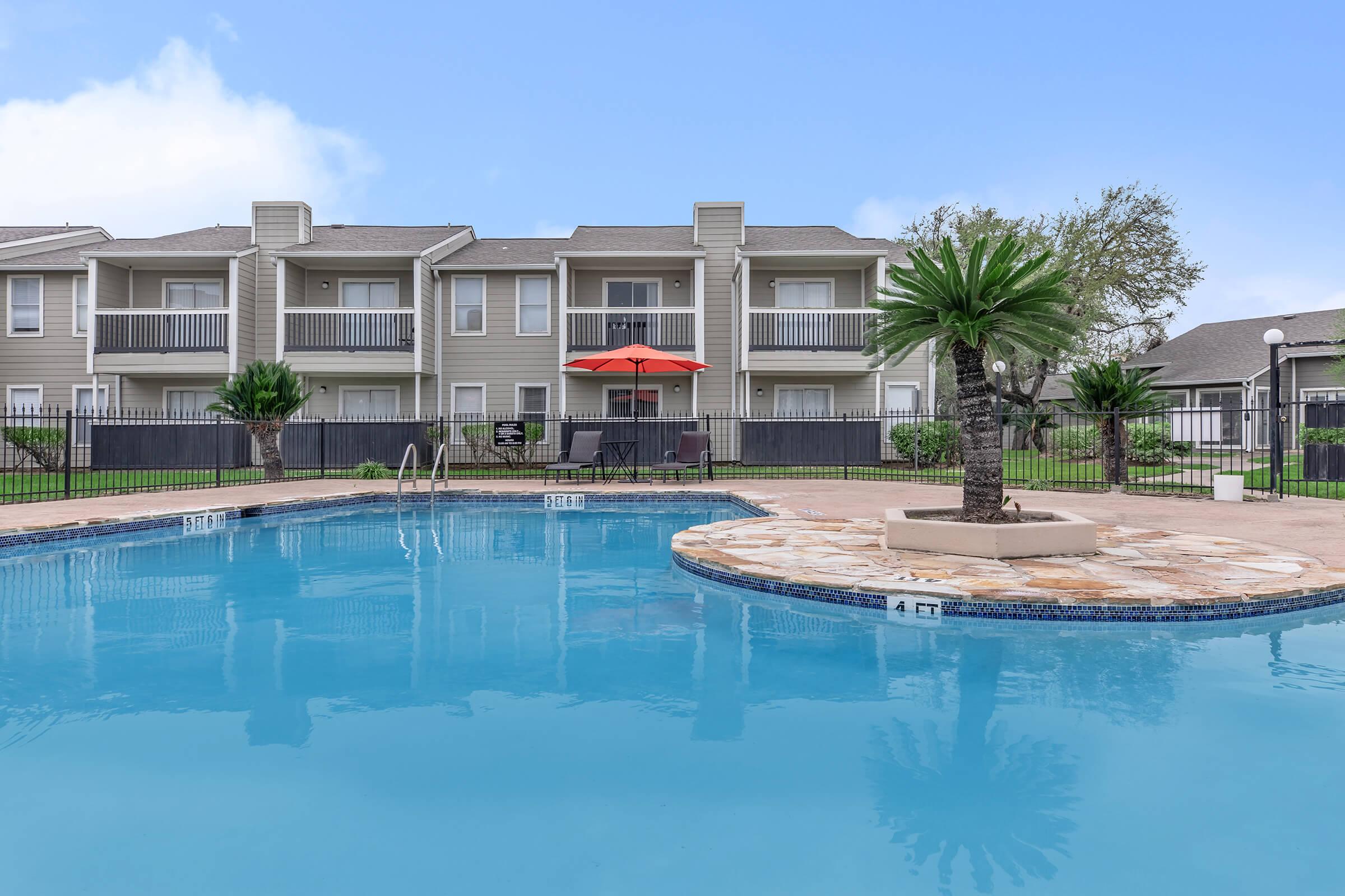 a large pool of water in front of a building