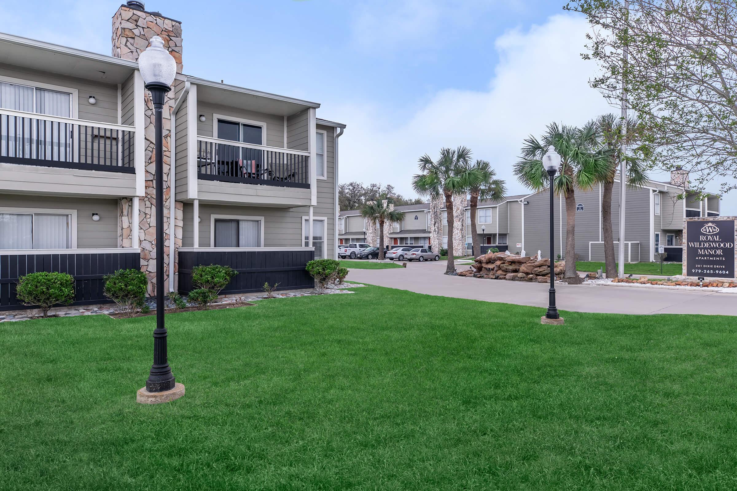 a large lawn in front of a building