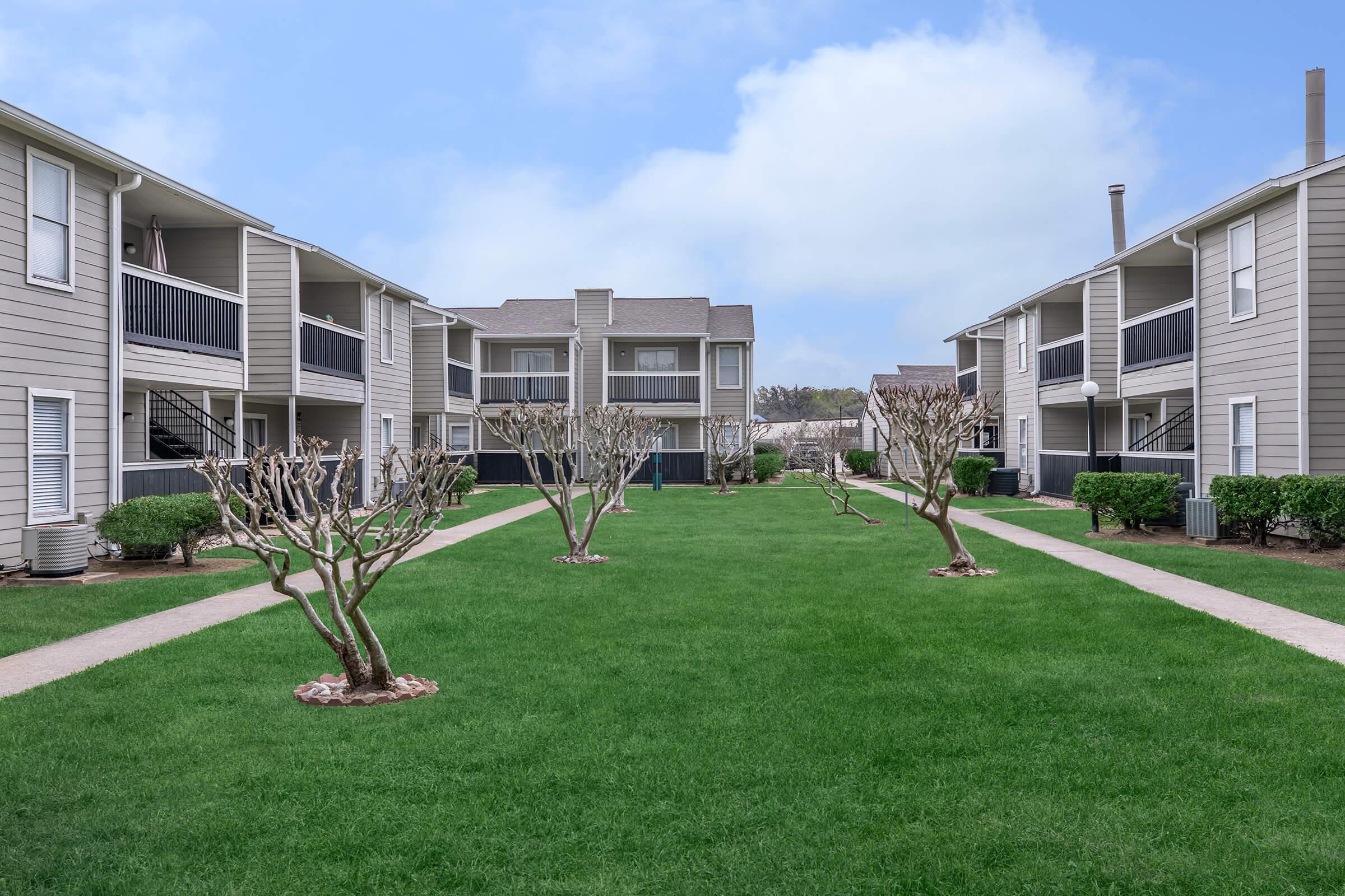 a large lawn in front of a house