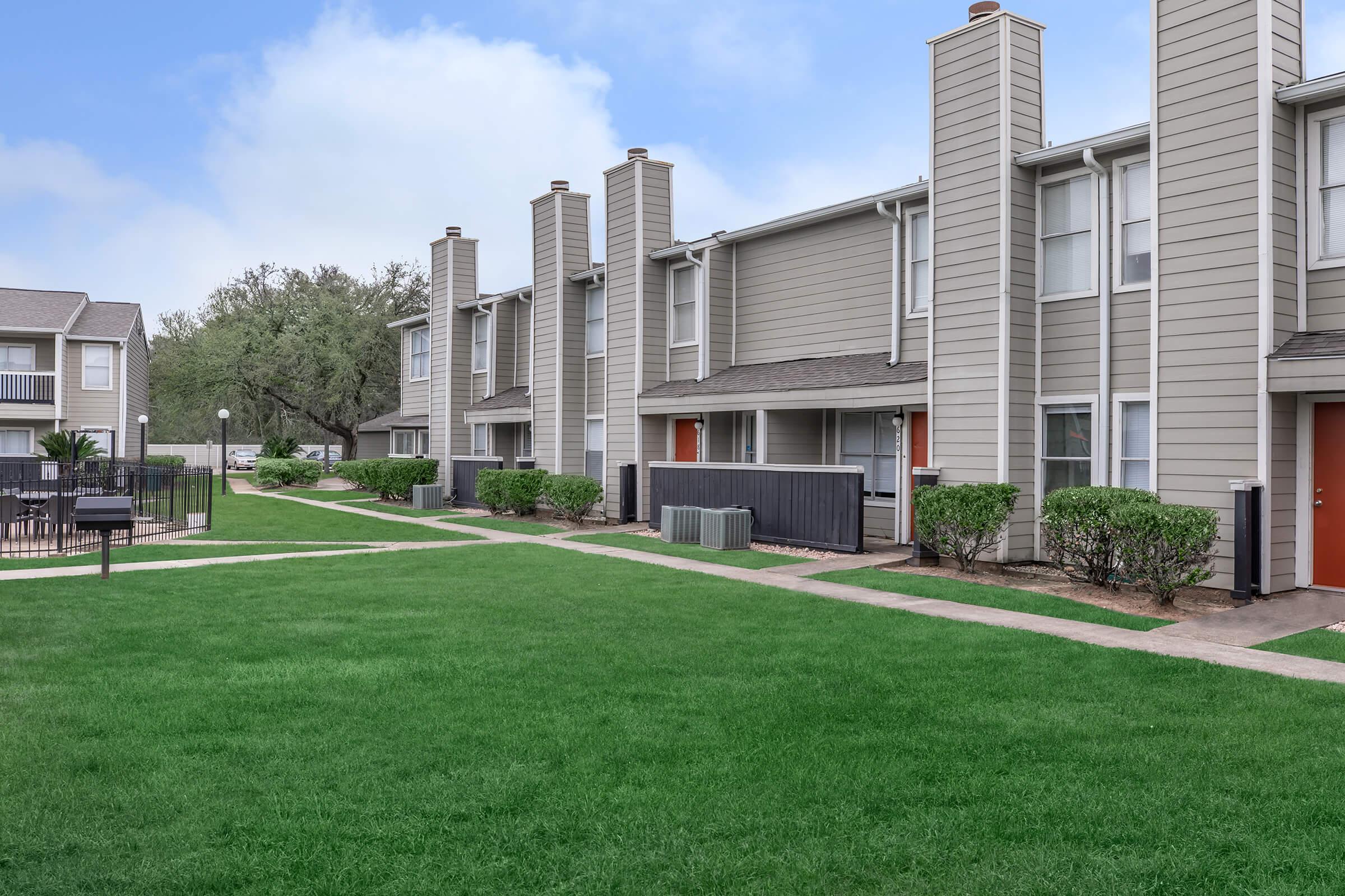 a large lawn in front of a building