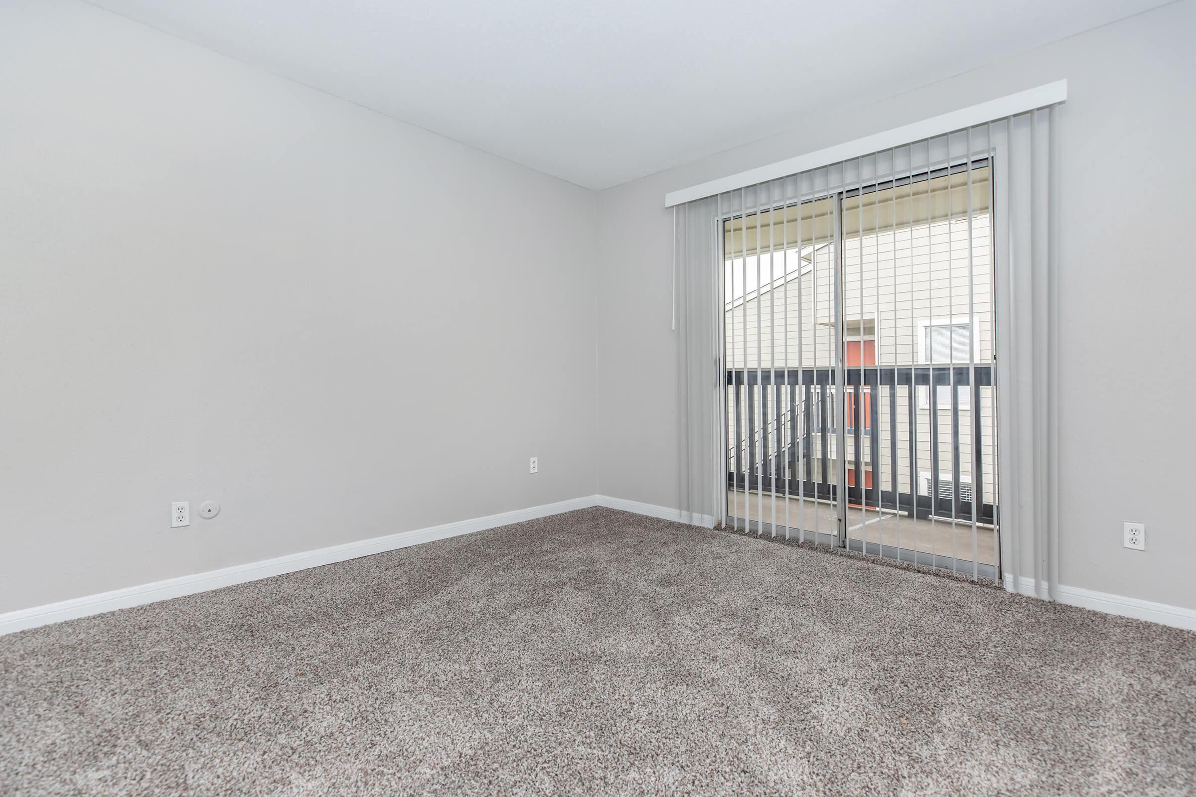 a bedroom with a large window