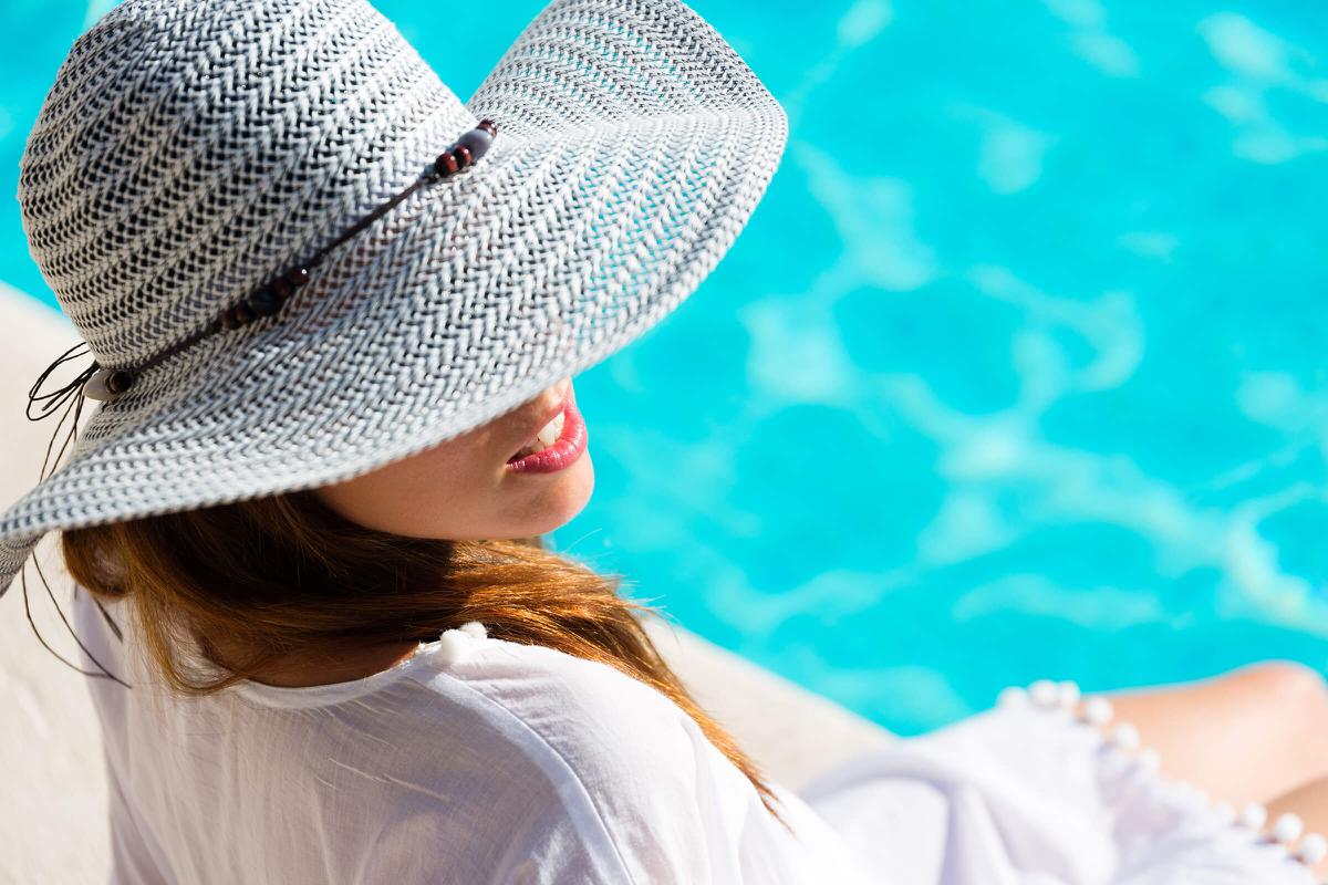 woman relaxing at poolside iStock-516652390.jpg