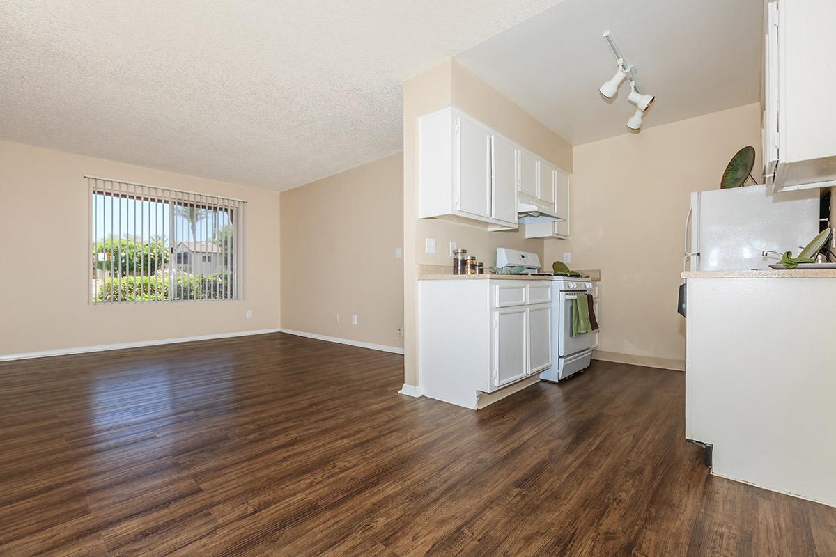 a kitchen with a wood floor