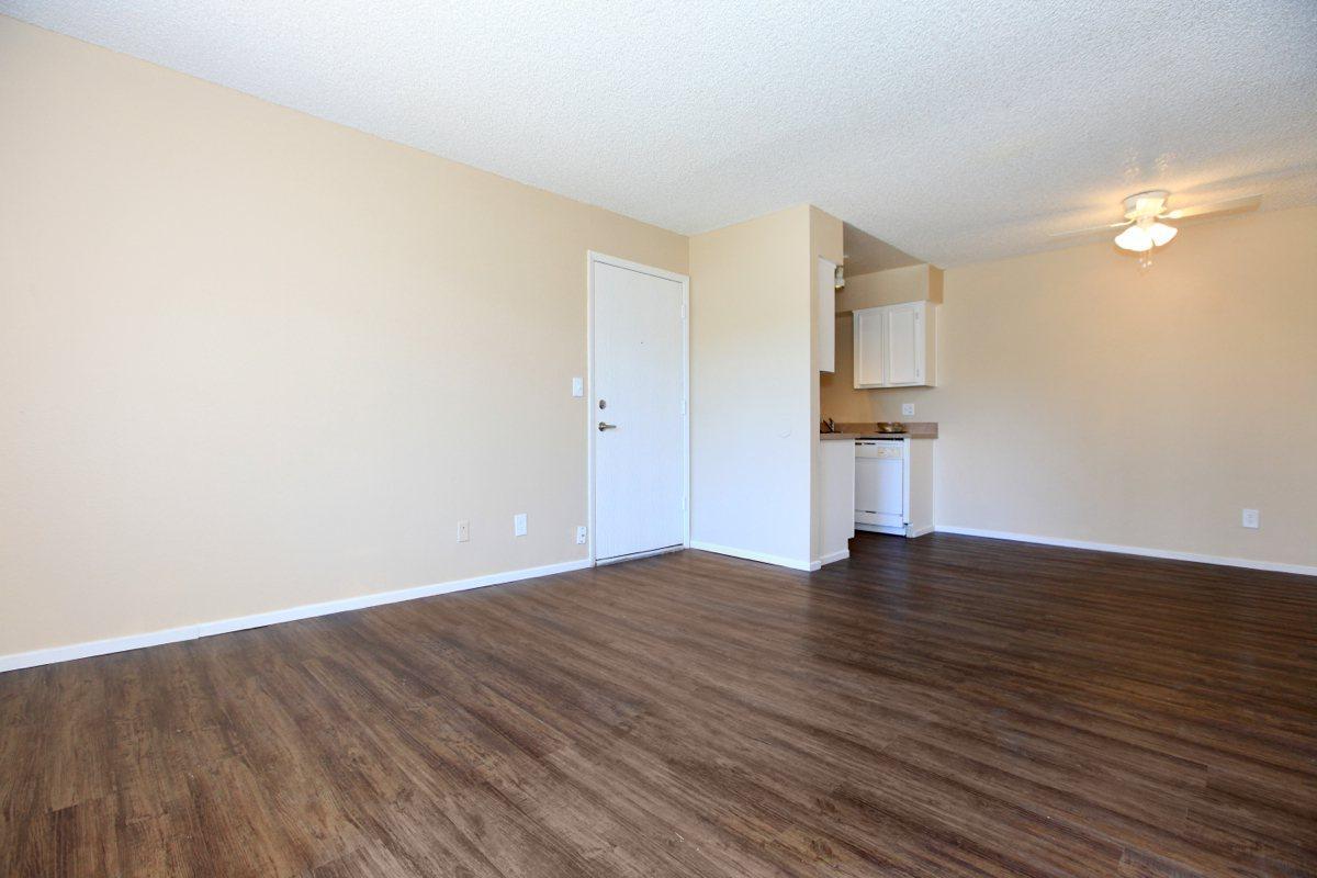 a large empty room with a wood floor