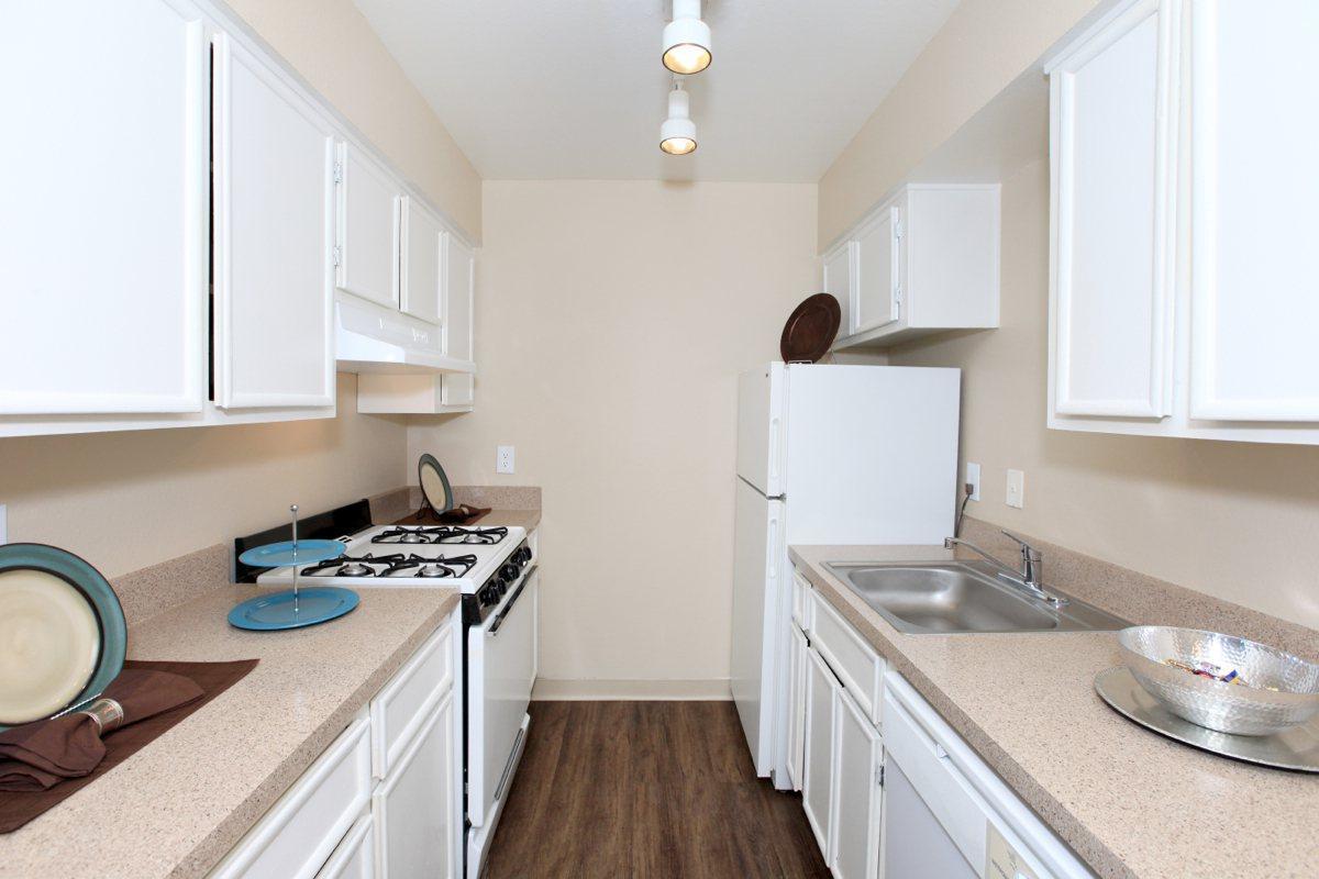 a kitchen with a stove and a sink