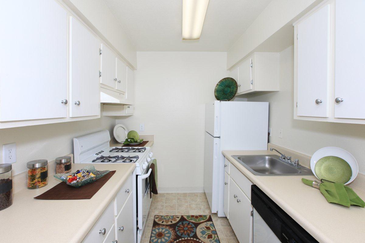 a kitchen with a stove and a sink