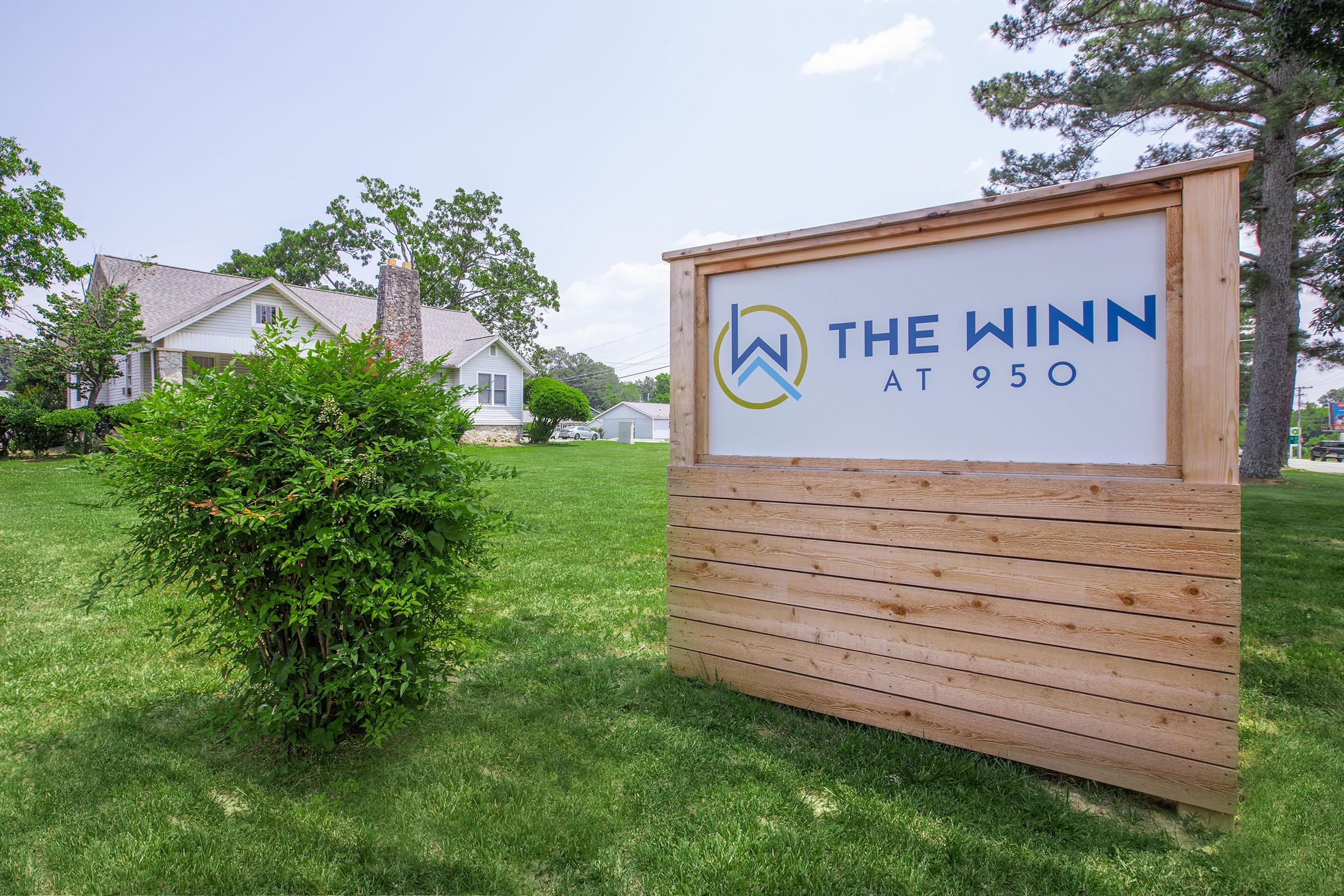 a sign in front of a house