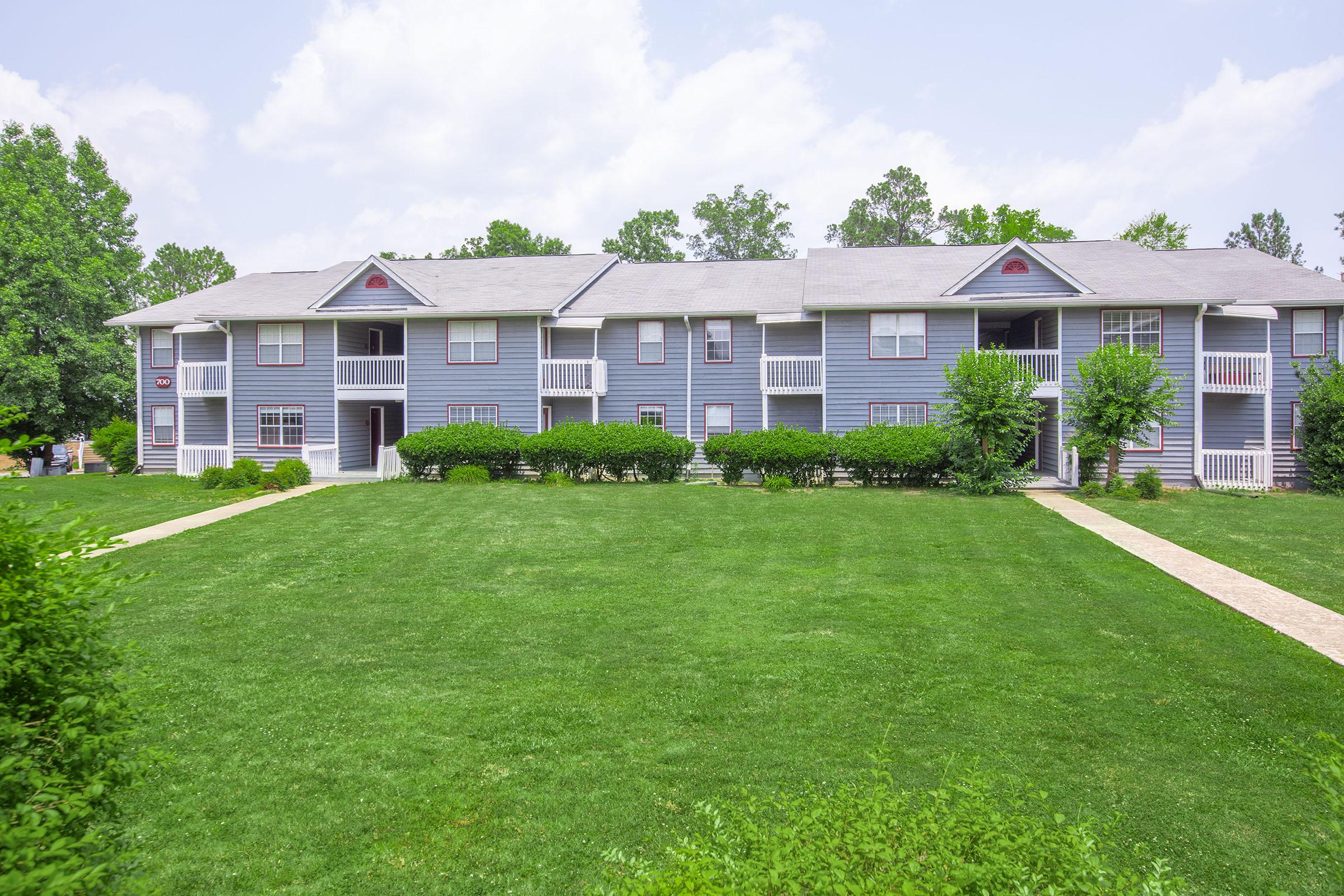 a green lawn in front of a house