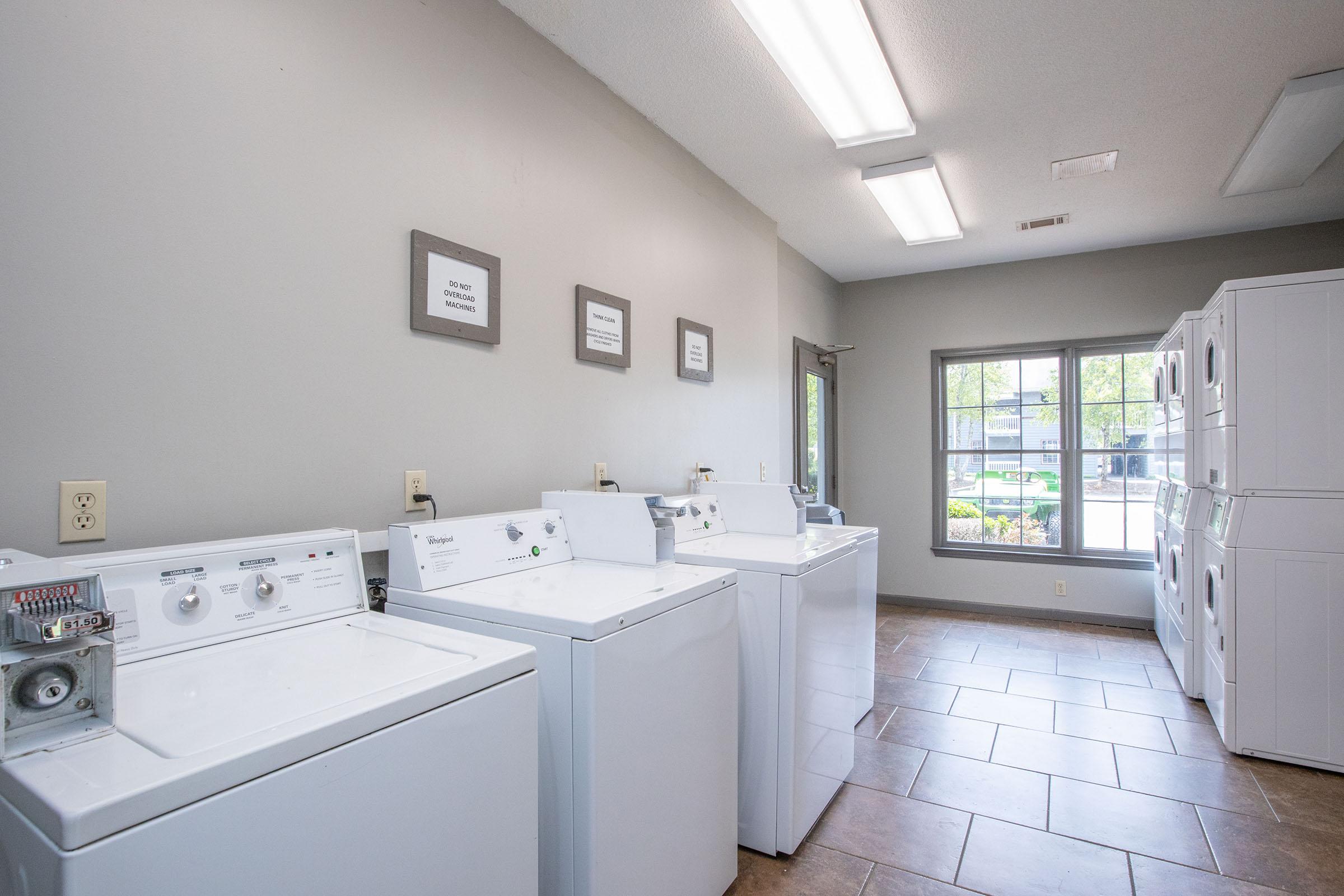 a kitchen with a sink and a mirror