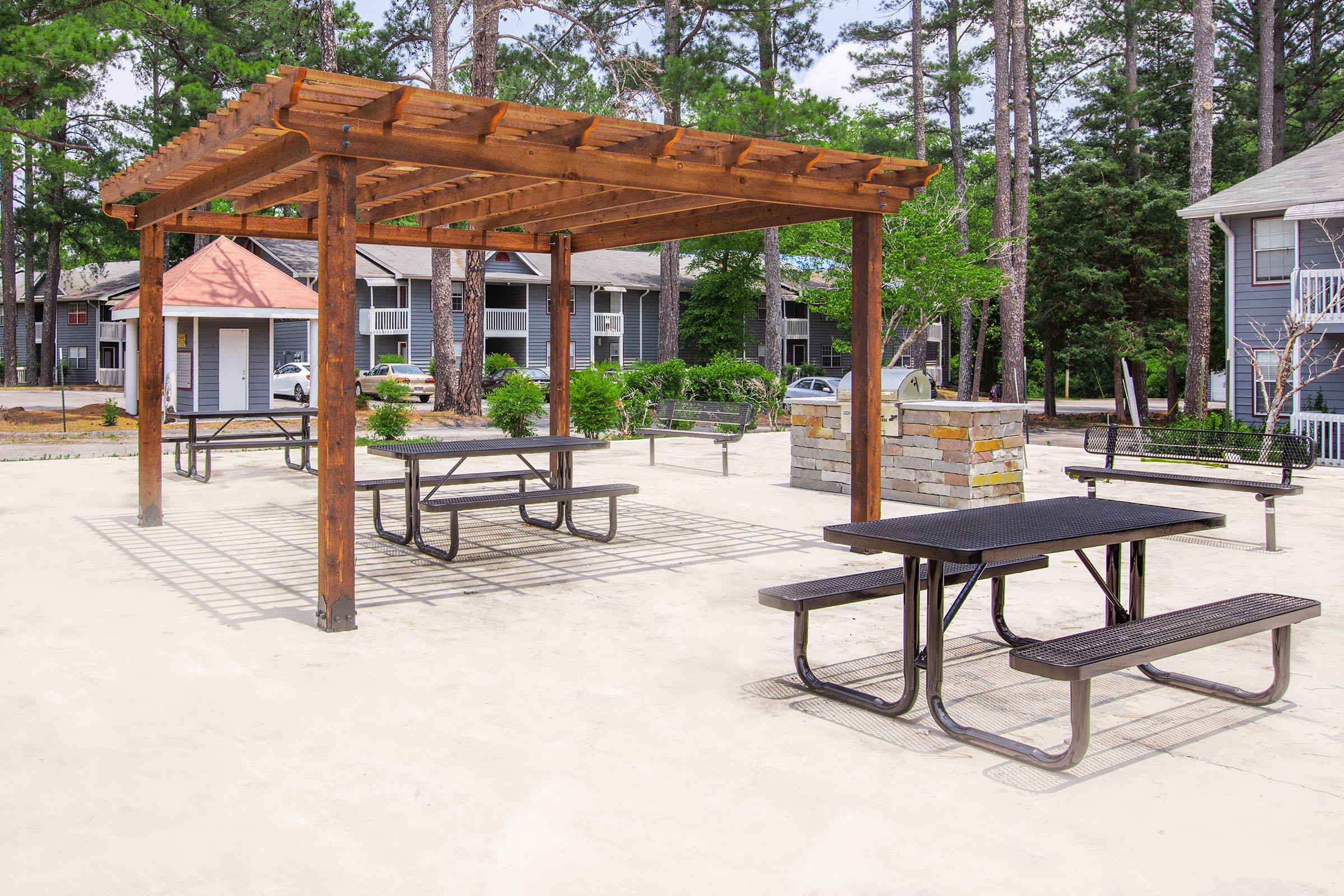 a group of lawn chairs sitting on top of a wooden table