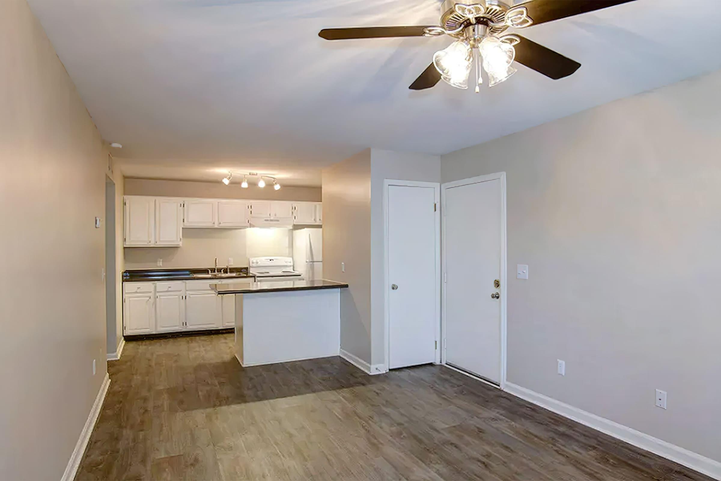 a kitchen with a wood floor