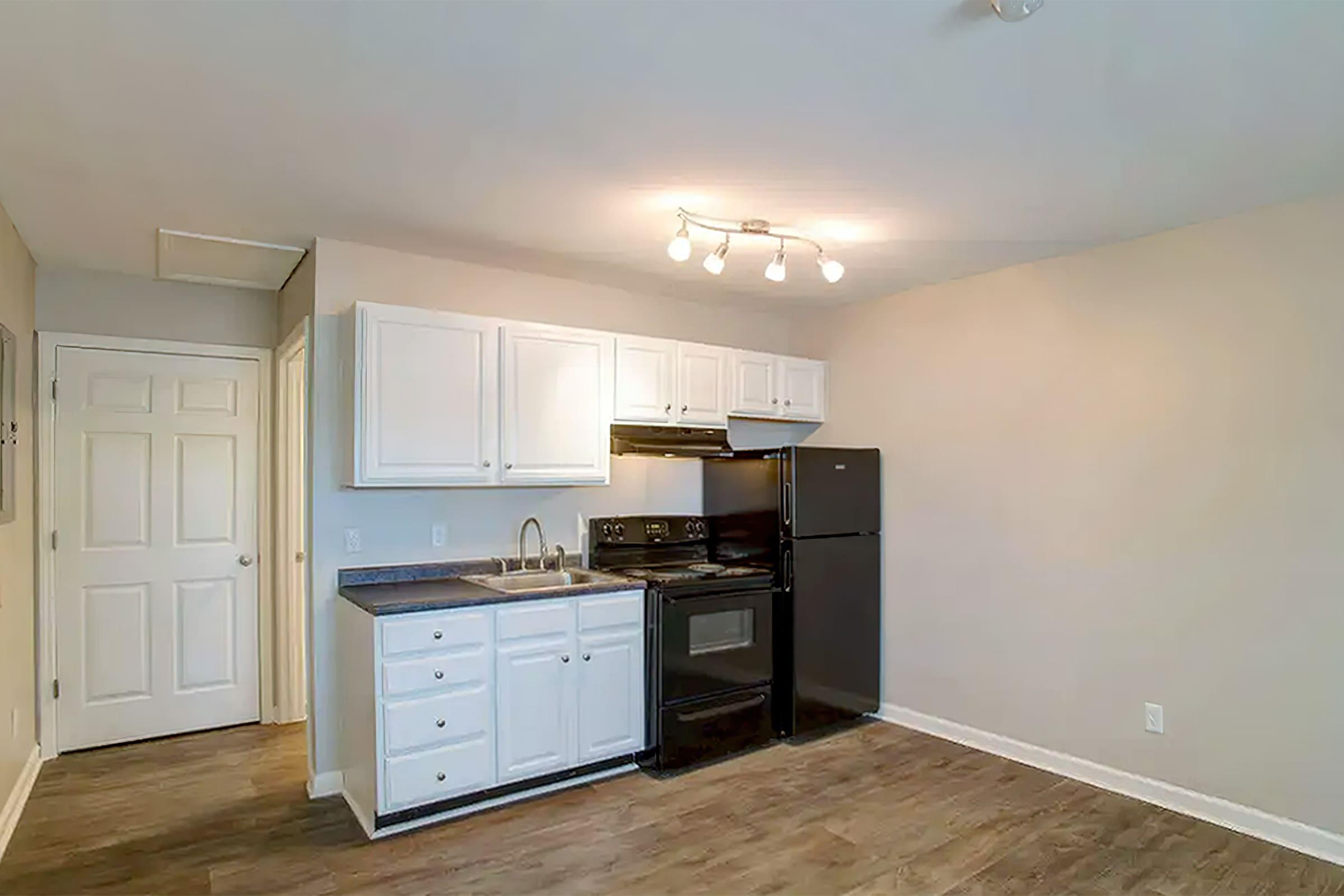 a kitchen with a wood floor