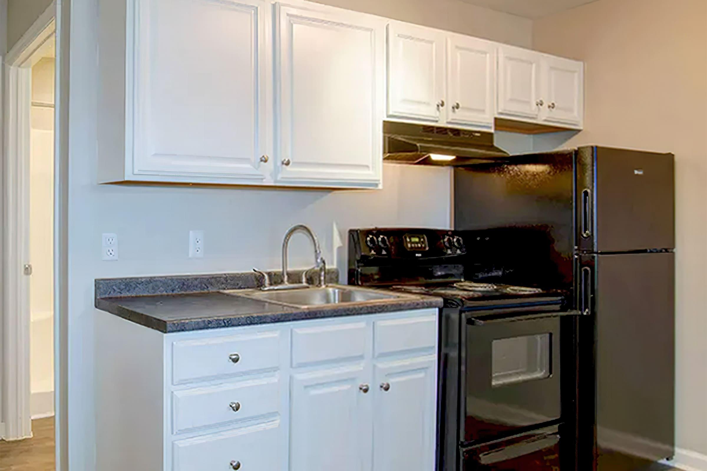 a kitchen with a stove top oven sitting inside of a refrigerator