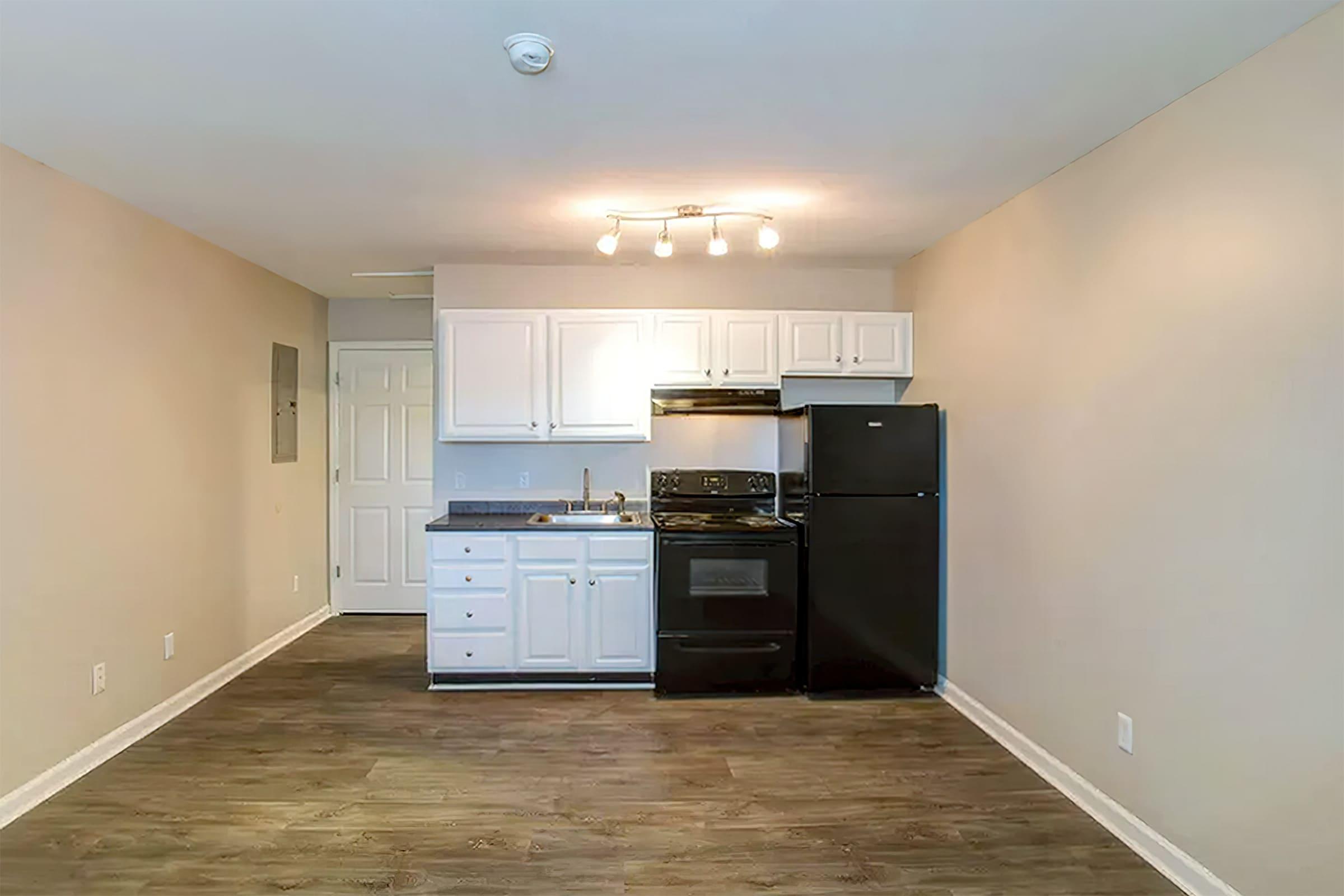 a kitchen with a wooden floor