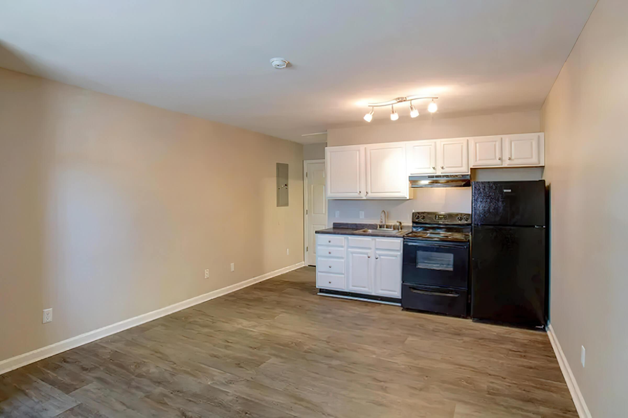 a kitchen with a wood floor