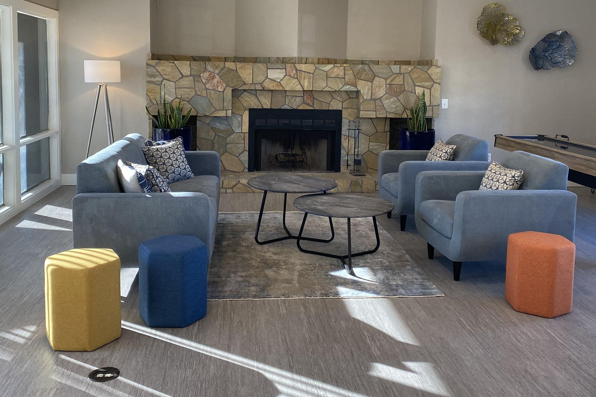 a living room filled with furniture and a fireplace