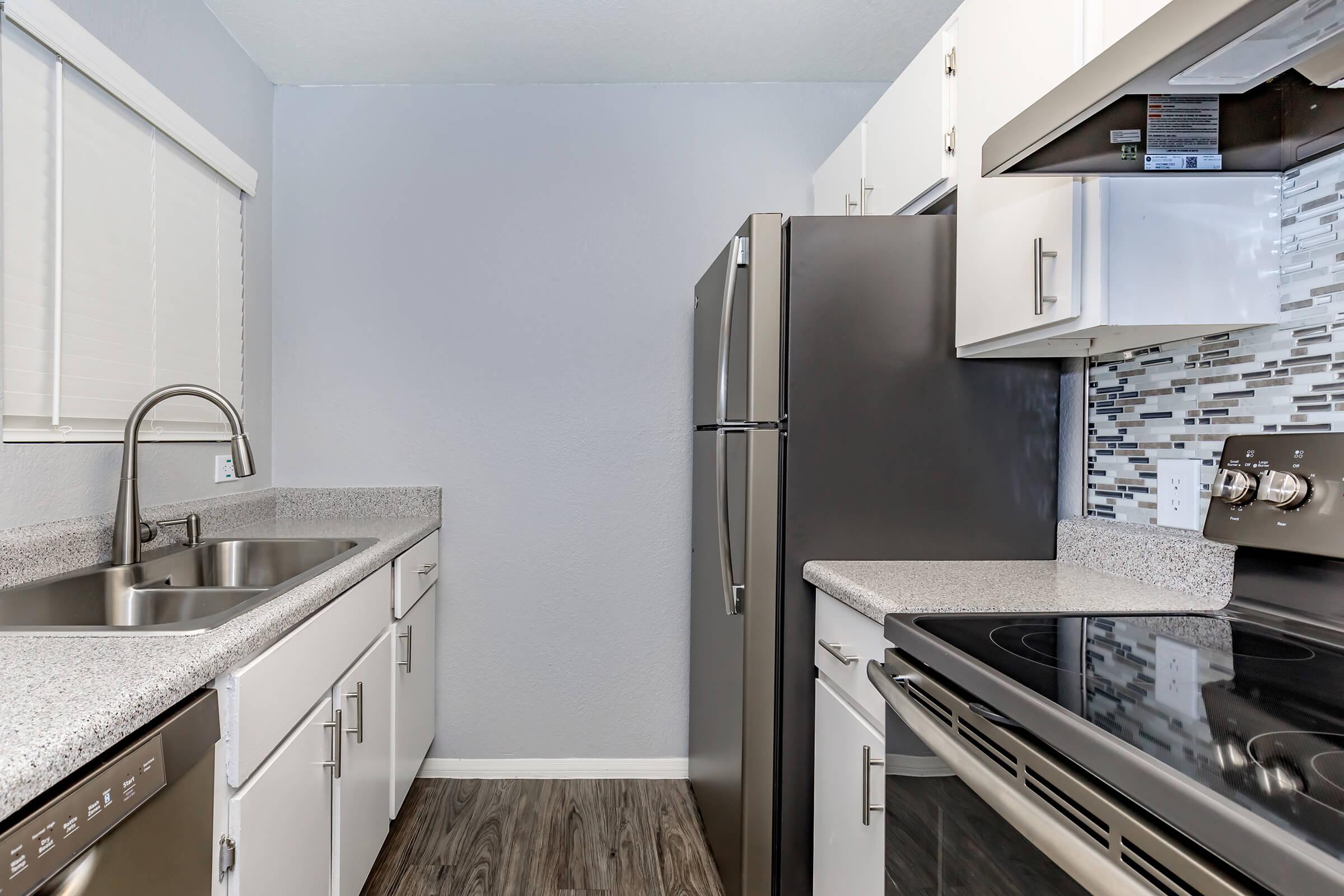 a modern kitchen with stainless steel appliances