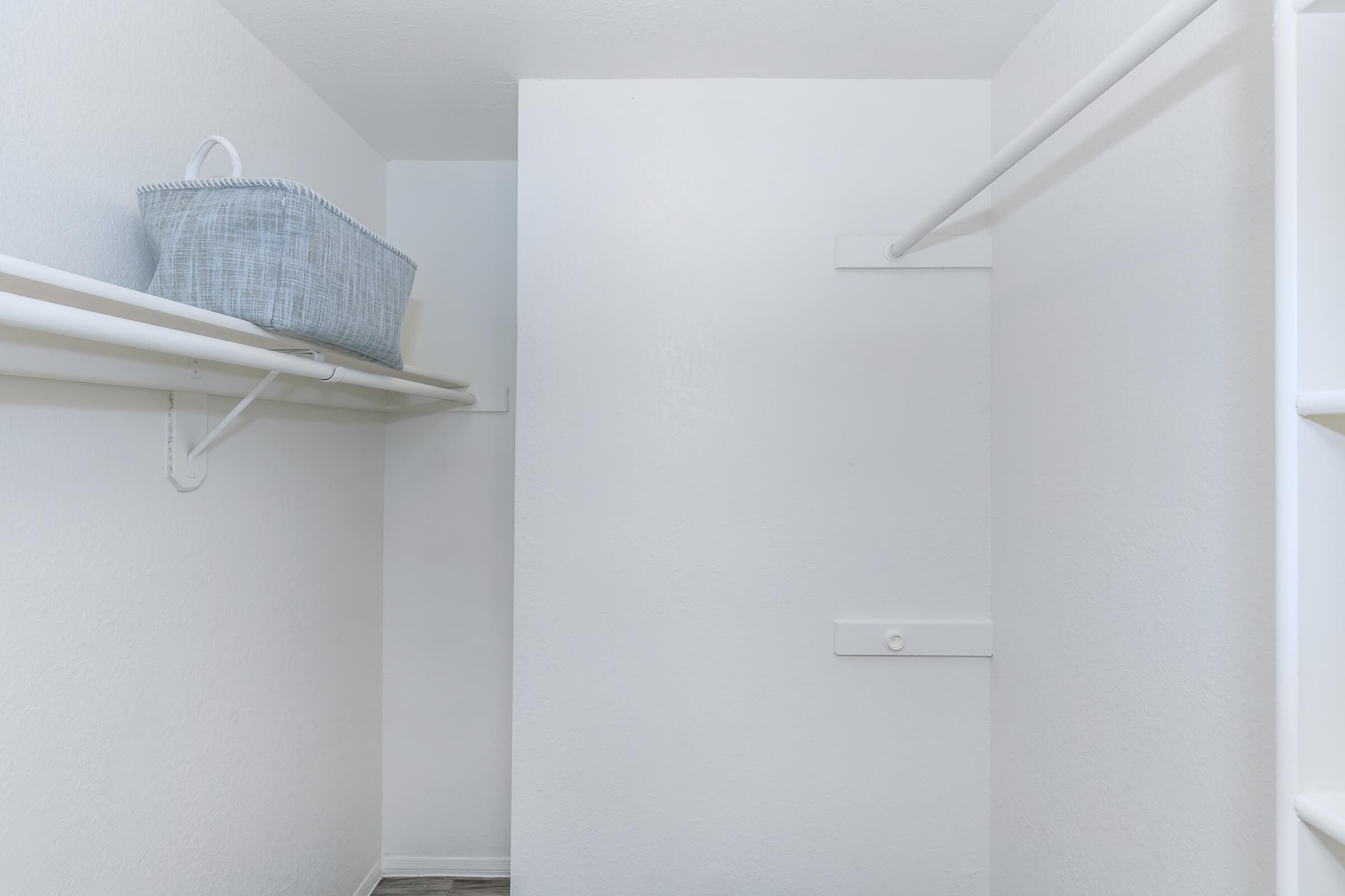 a white refrigerator freezer sitting next to a shower