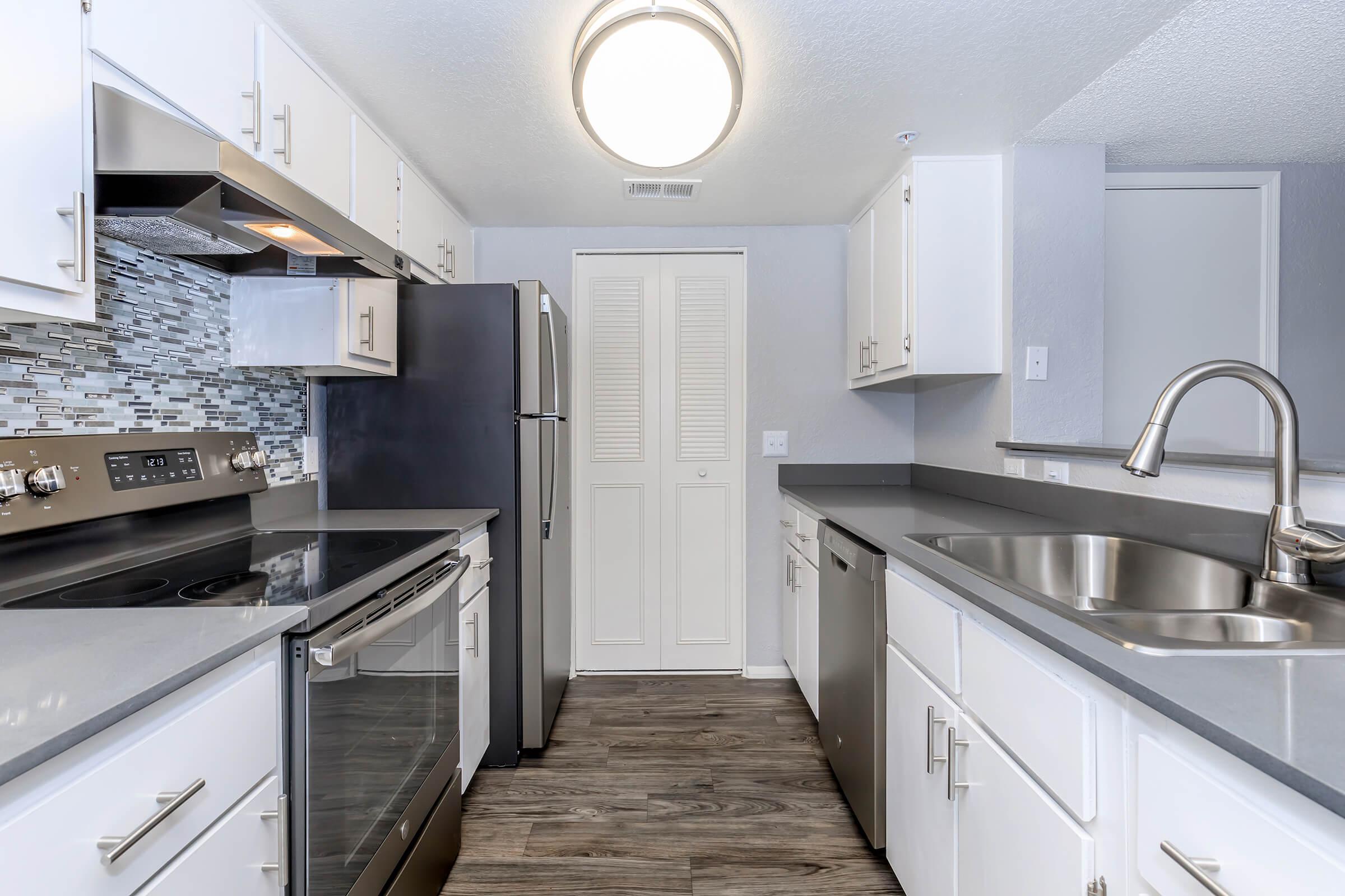 a kitchen with a stove top oven