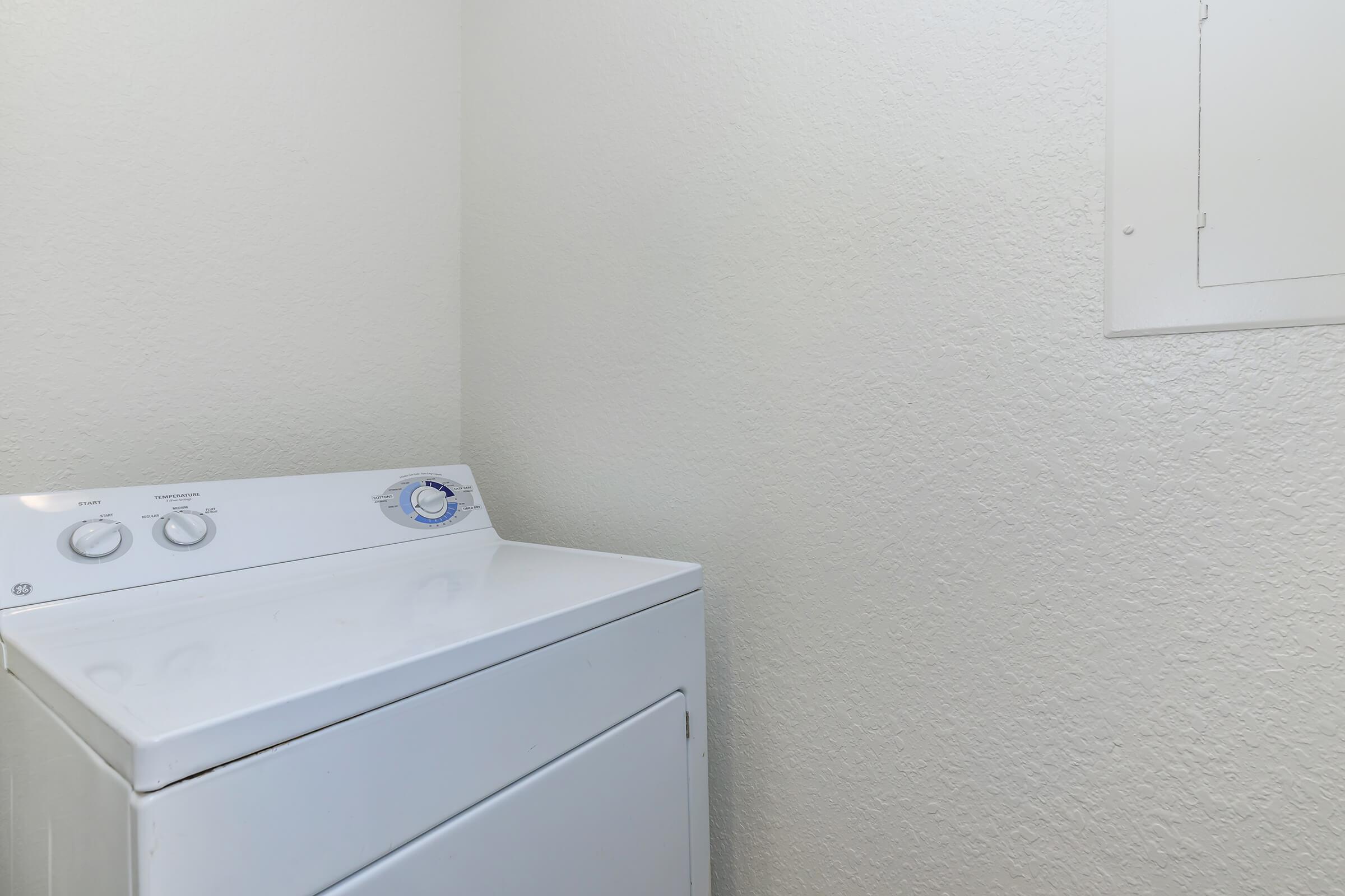 a white refrigerator freezer sitting in a room