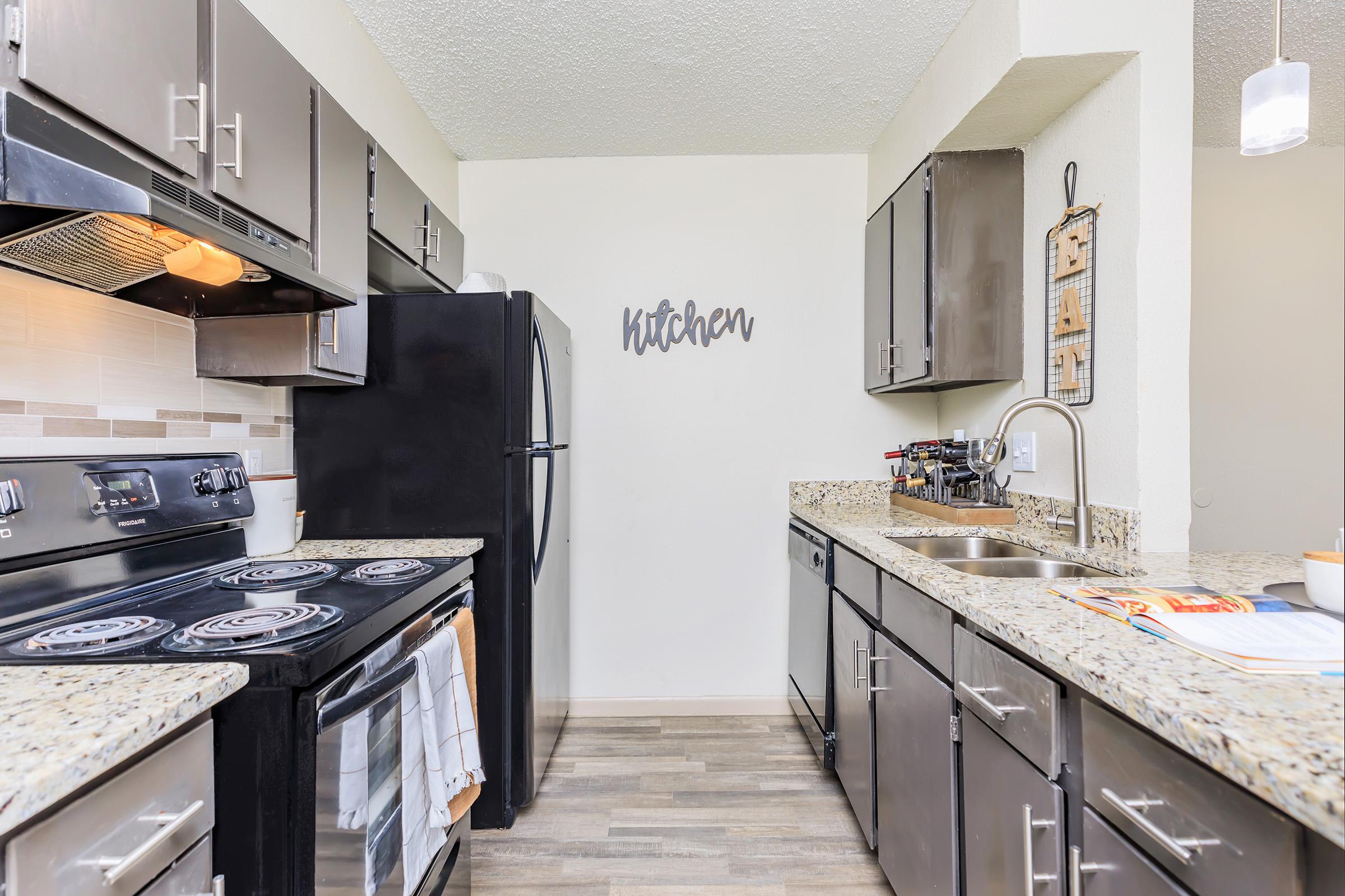 a modern kitchen with stainless steel appliances