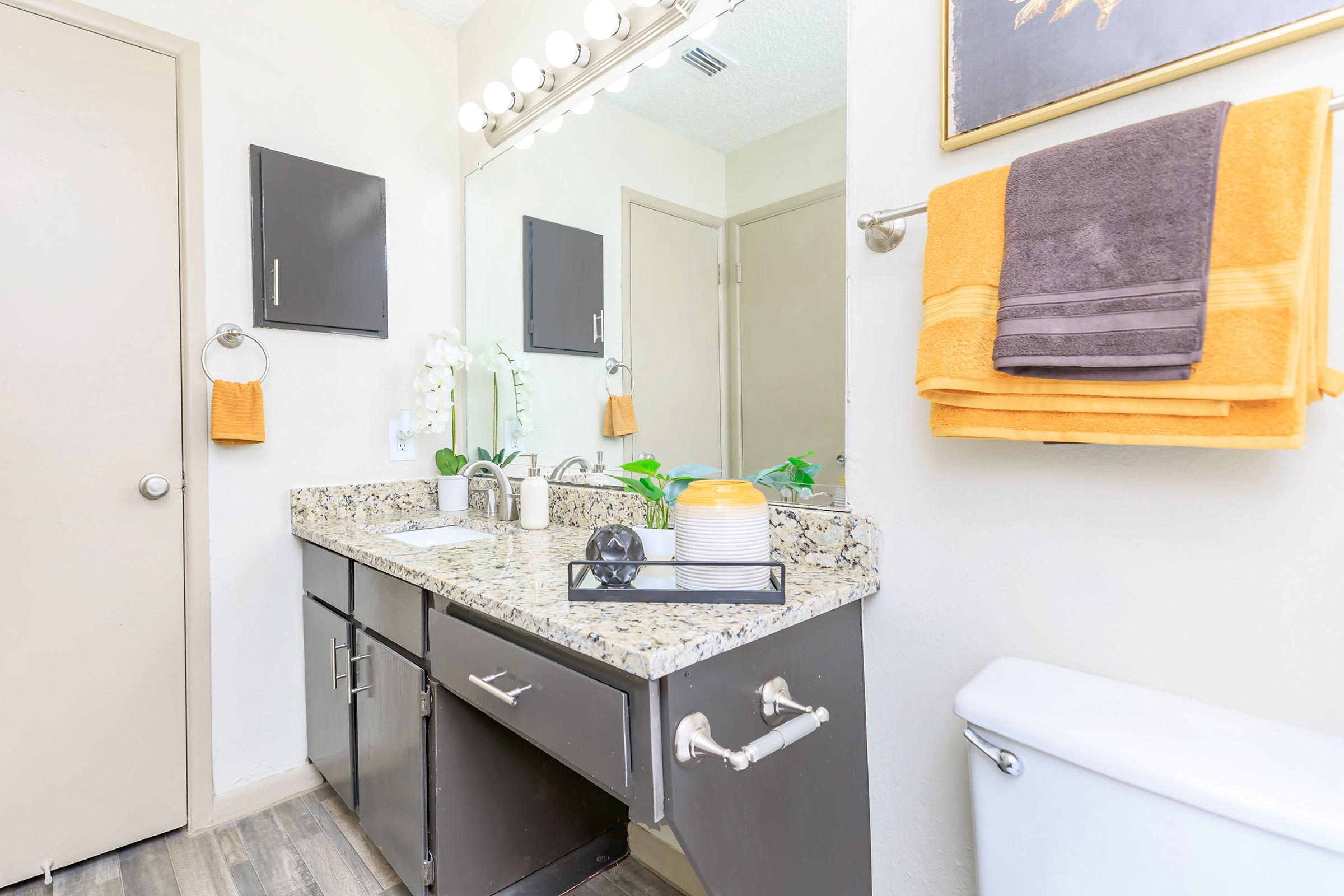 a kitchen with a sink and a mirror