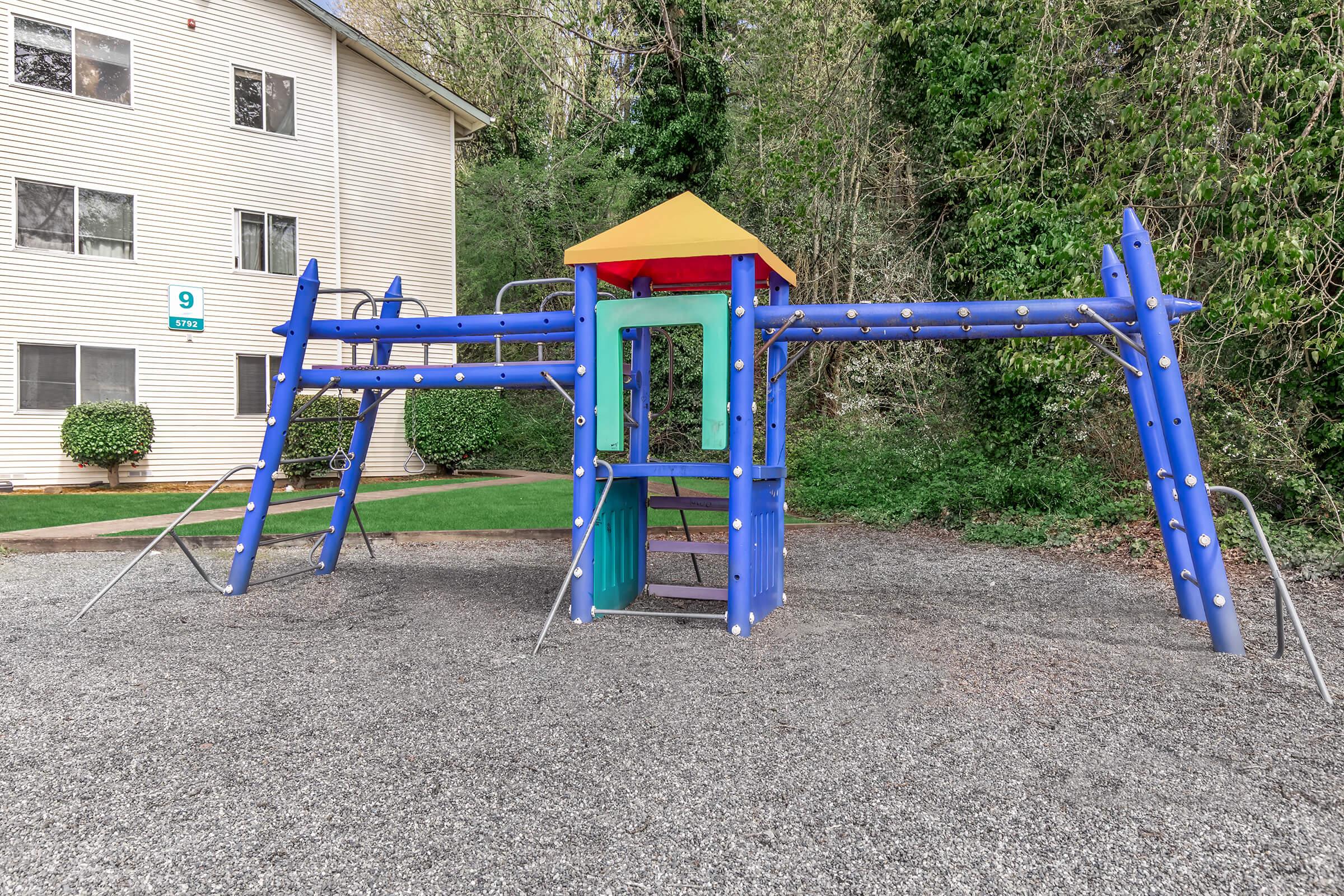 a playground in front of a blue chair