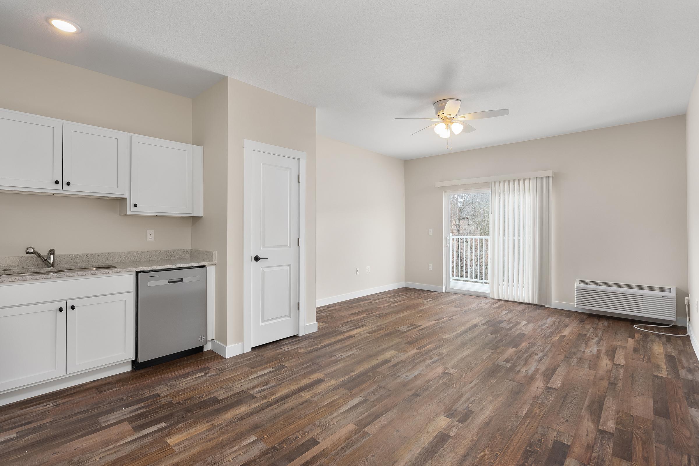 a kitchen with a wood floor