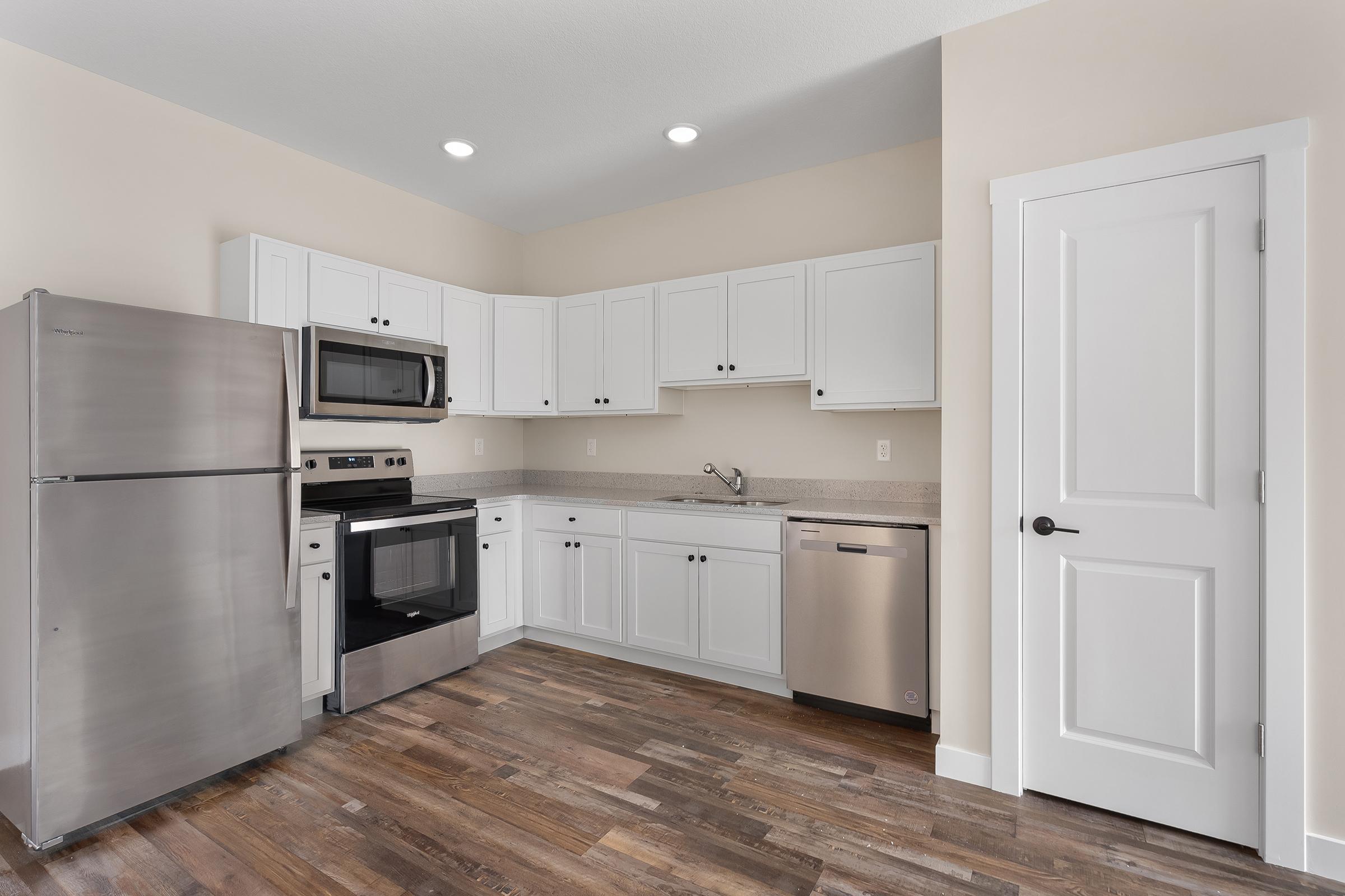 a stainless steel refrigerator in a kitchen