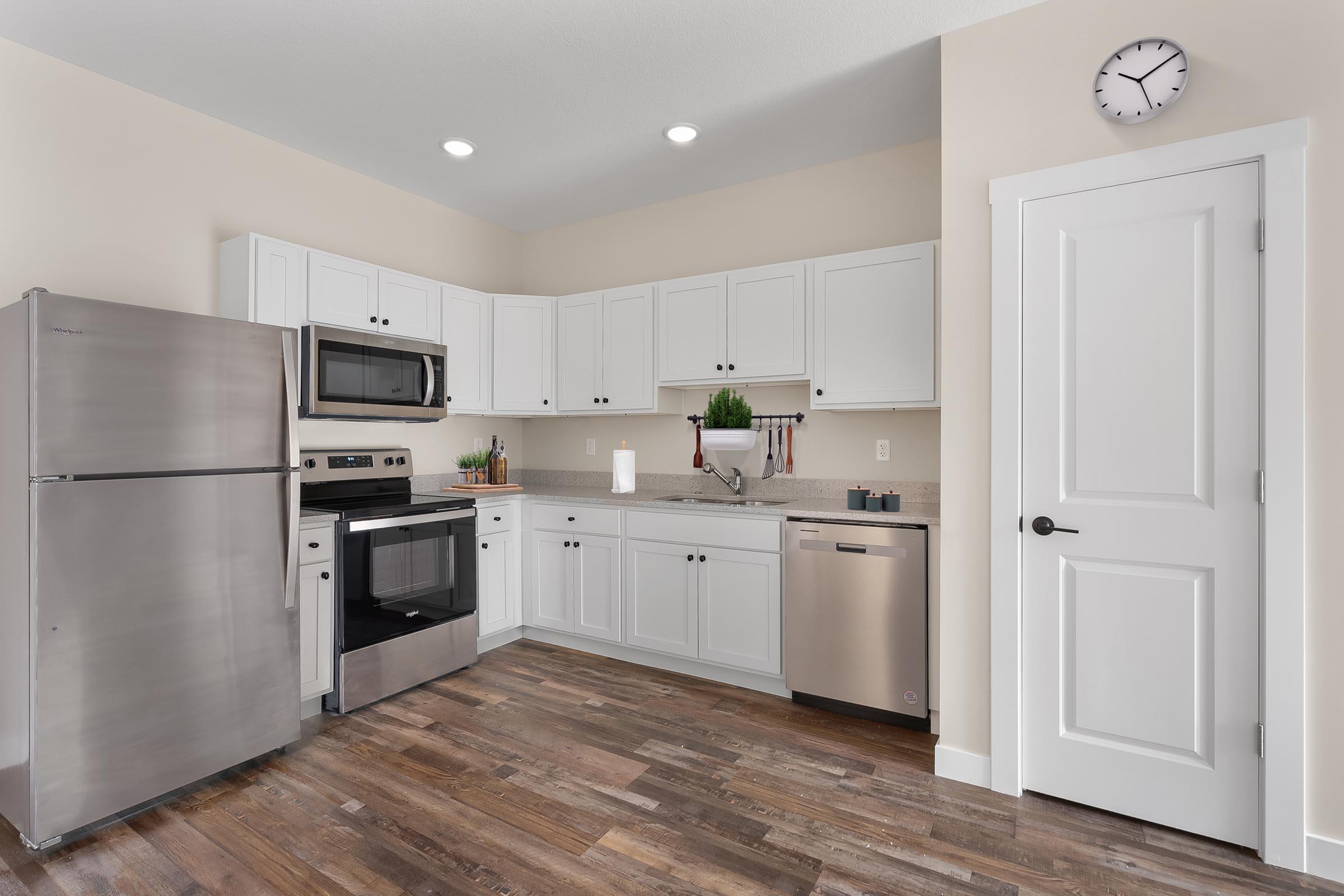 a stainless steel refrigerator in a kitchen