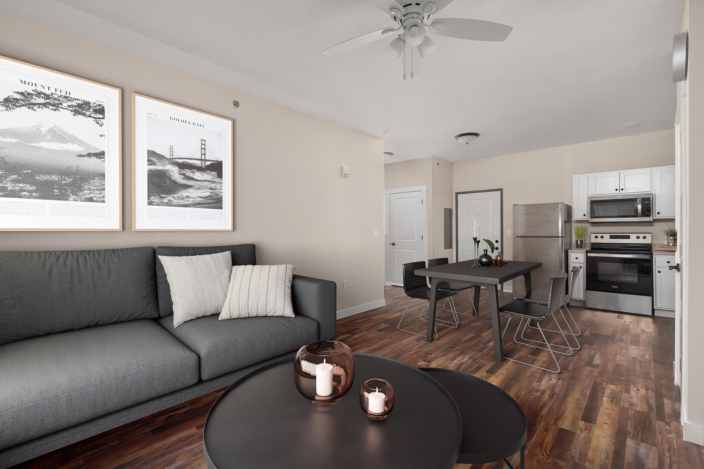 a living room filled with furniture and a flat screen tv