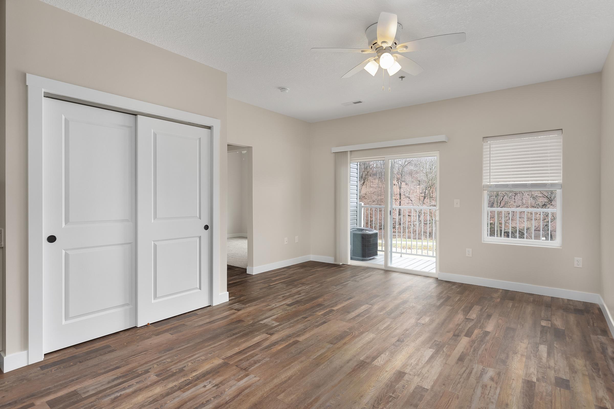 a large empty room with a wooden floor