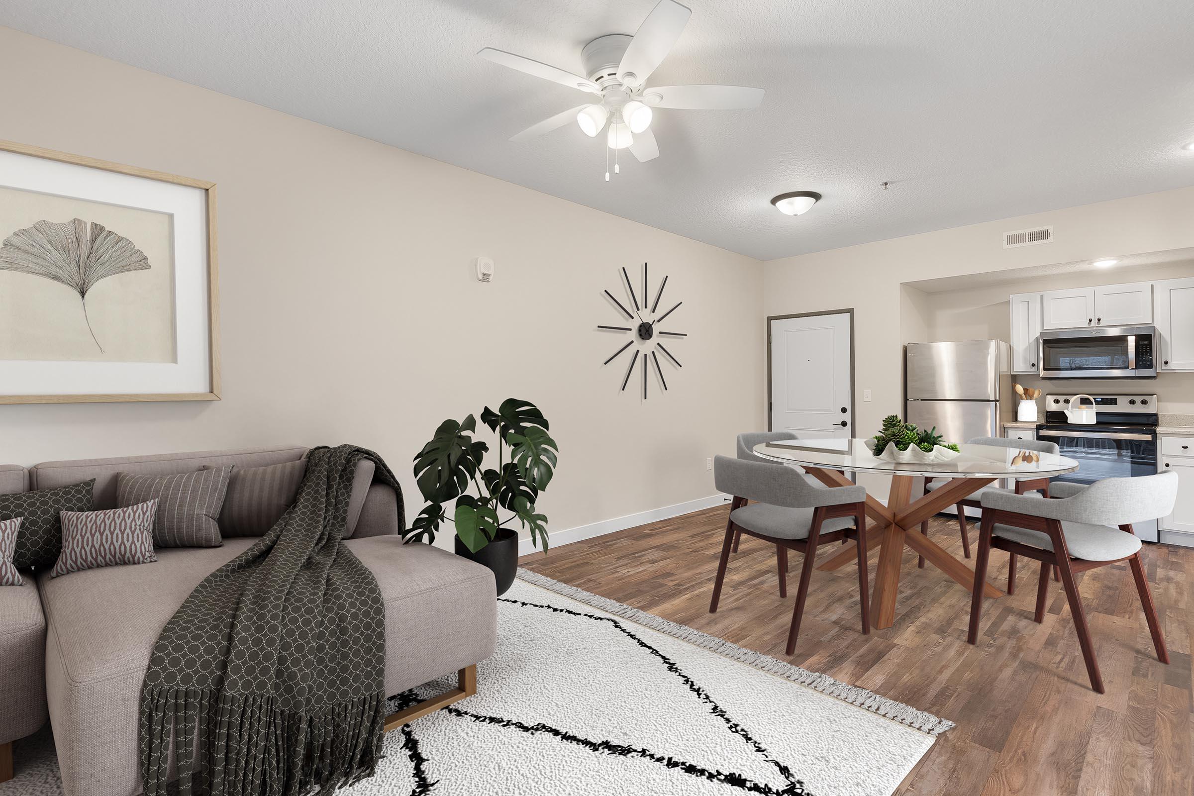 a living room filled with furniture and a rug