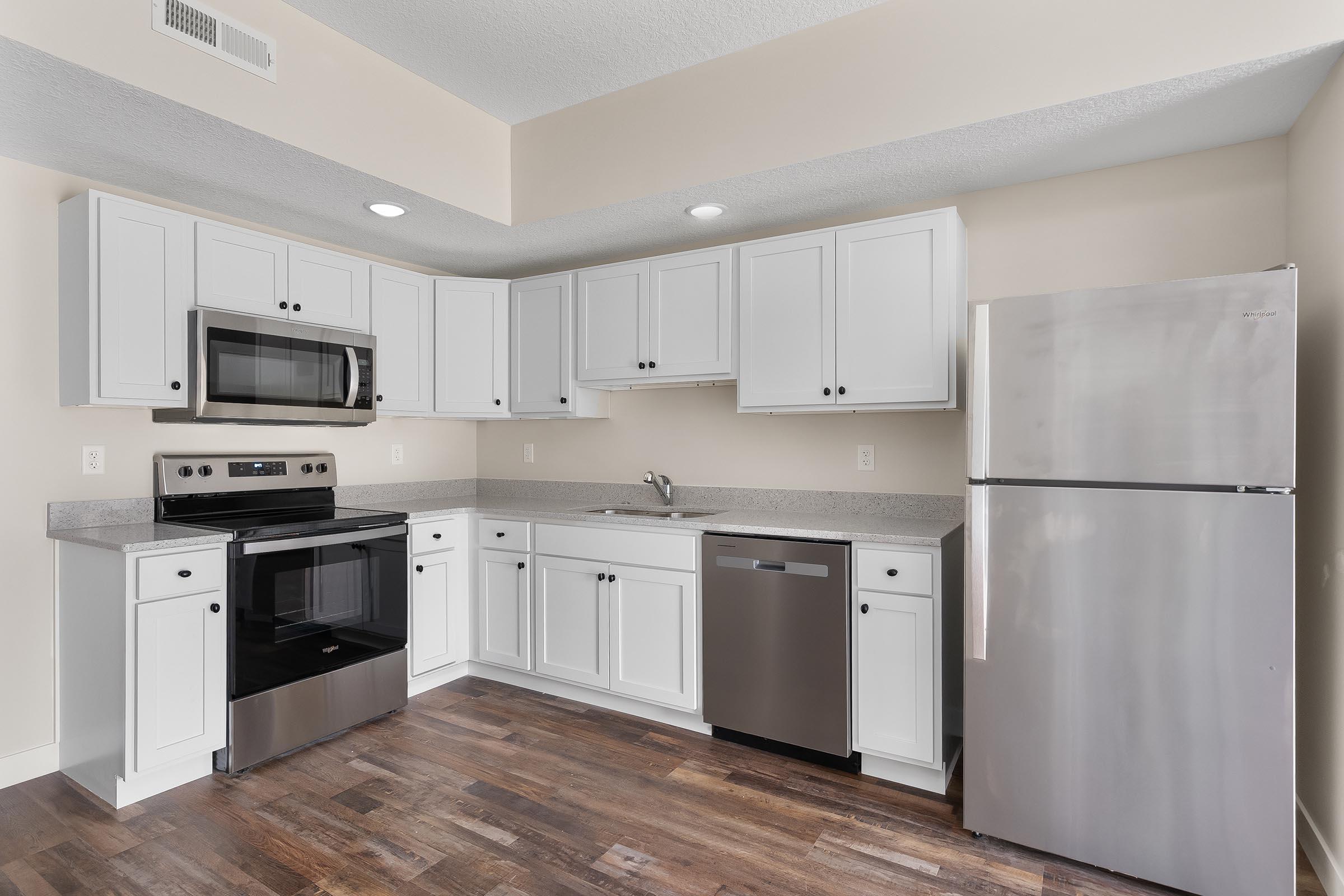 a kitchen with a stove and a refrigerator