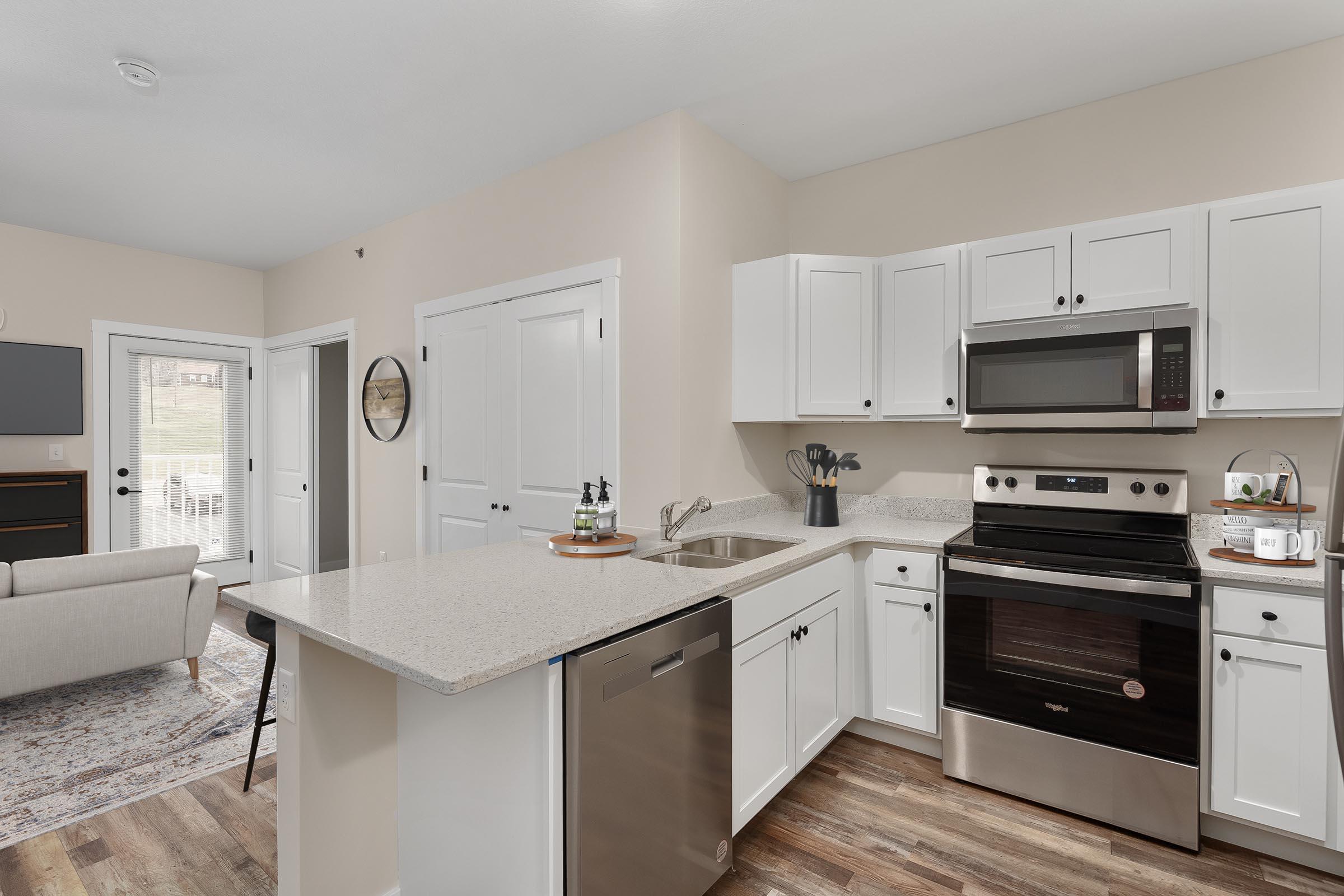 a kitchen with a sink and a refrigerator