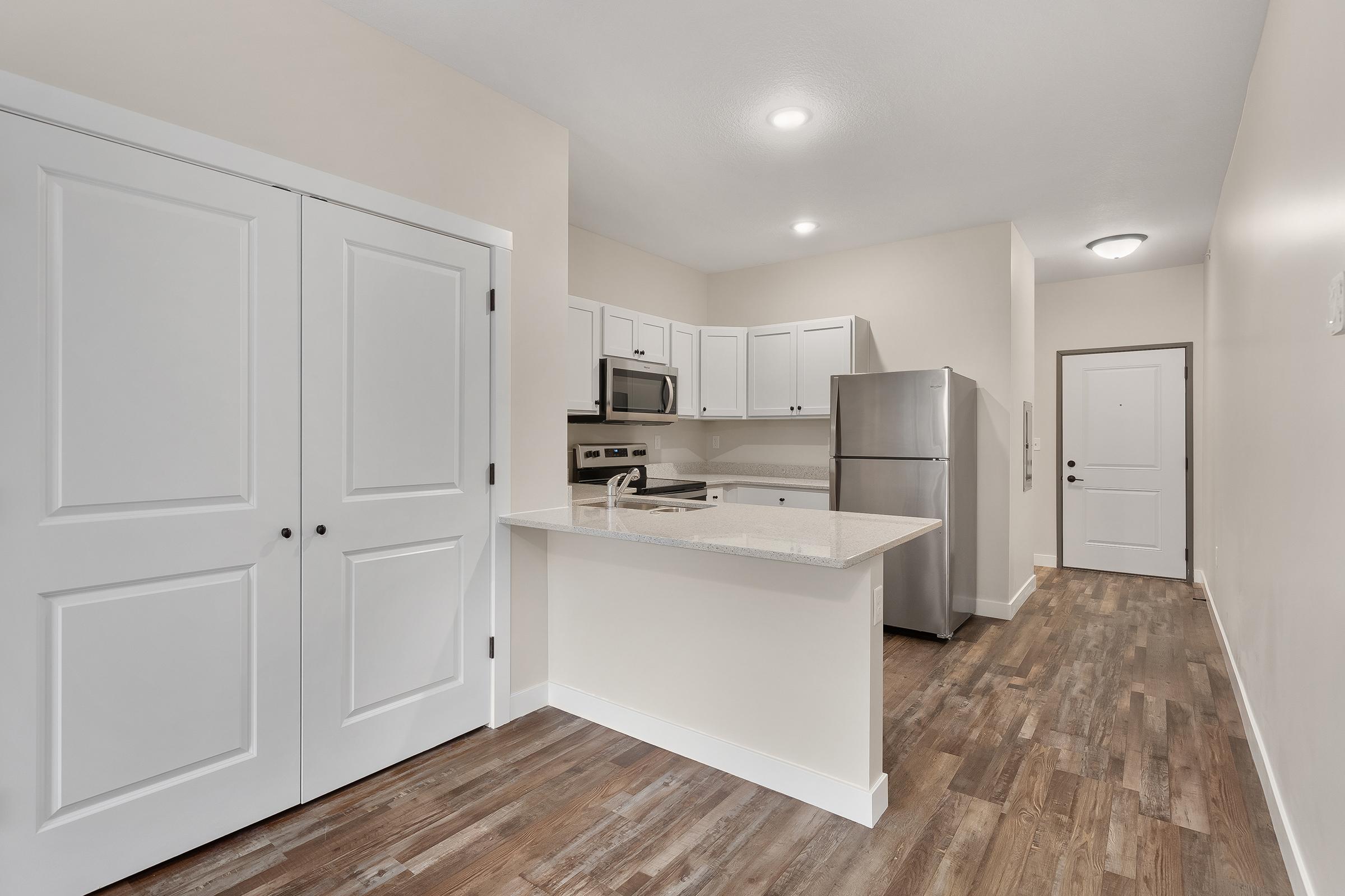 a kitchen with a wood floor