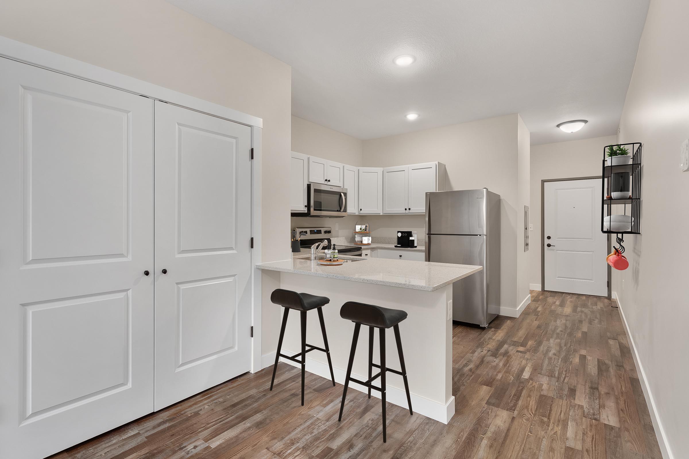 a kitchen with a table in a room