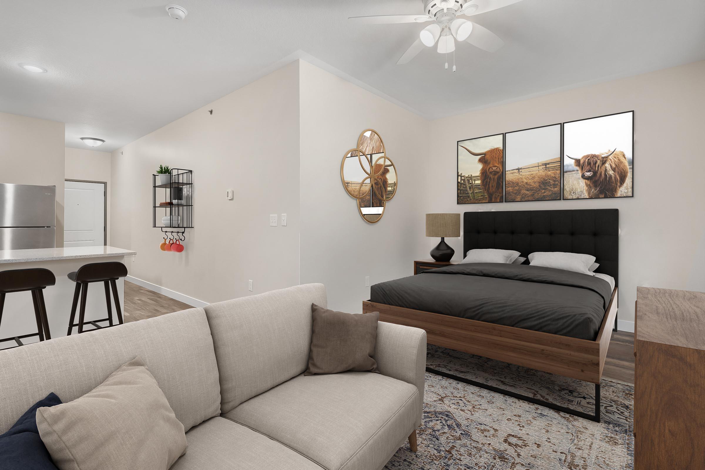 a living room filled with furniture and a flat screen tv