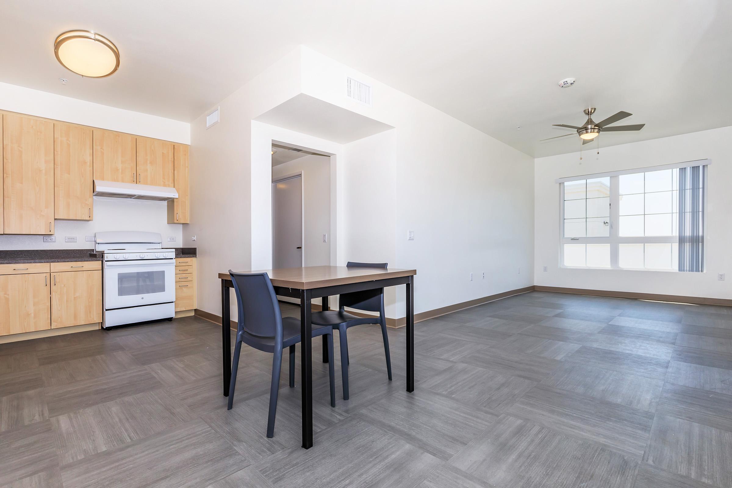 a room filled with furniture on top of a hard wood floor