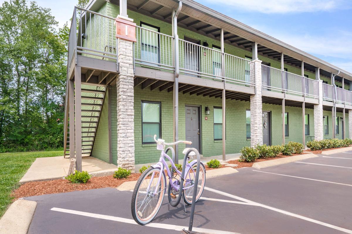 a bicycle parked on the side of a building