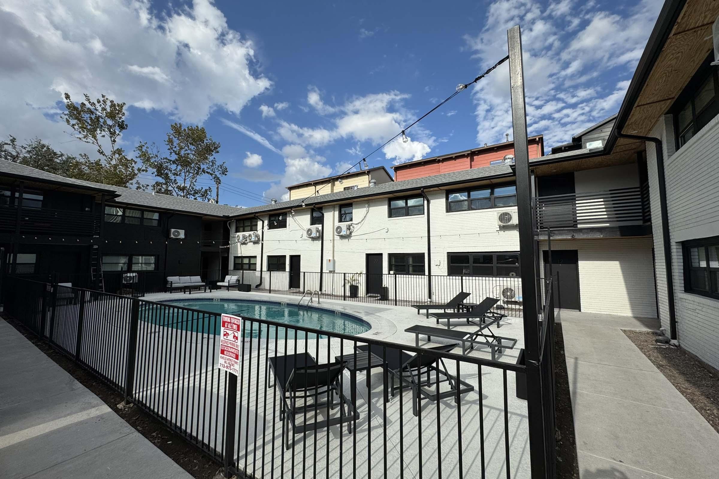 a building with a metal fence