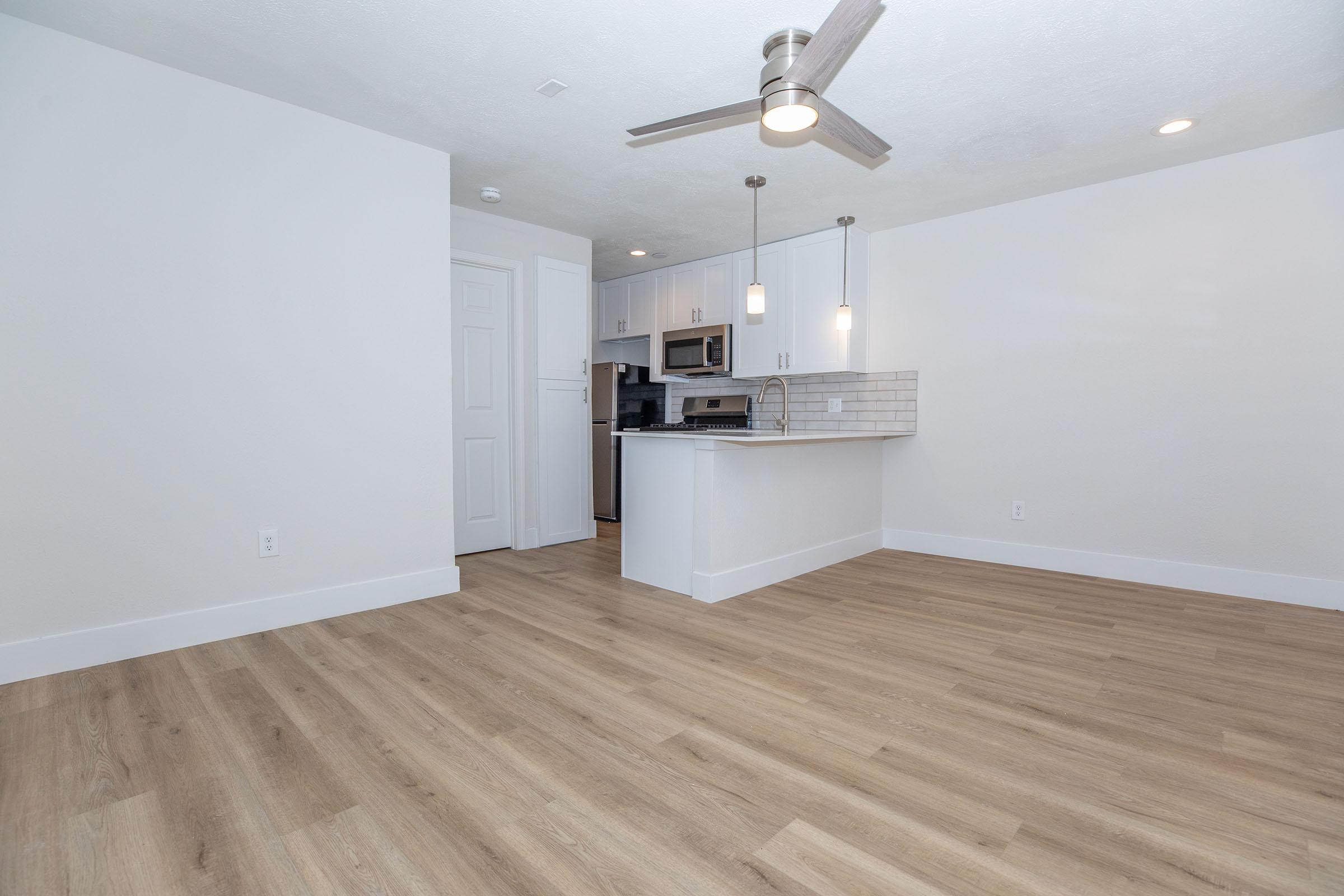 a kitchen with a wood floor