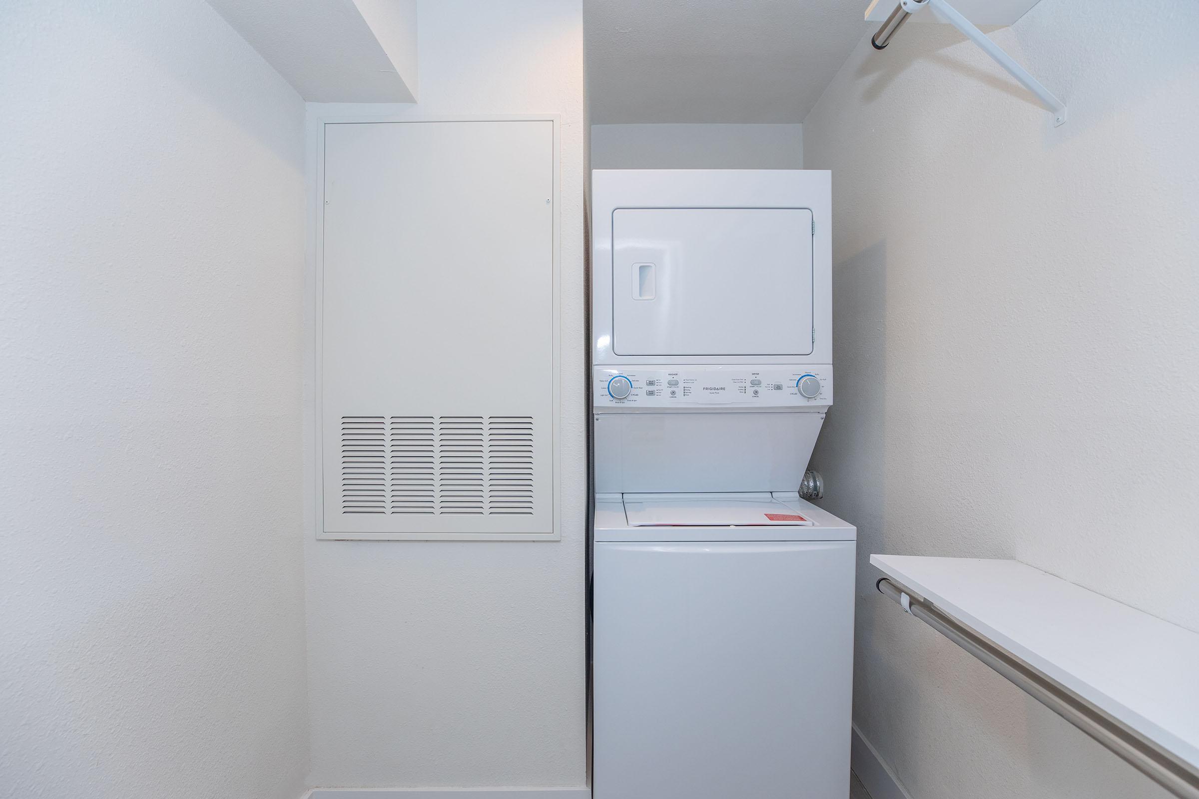 a refrigerator freezer sitting in a room