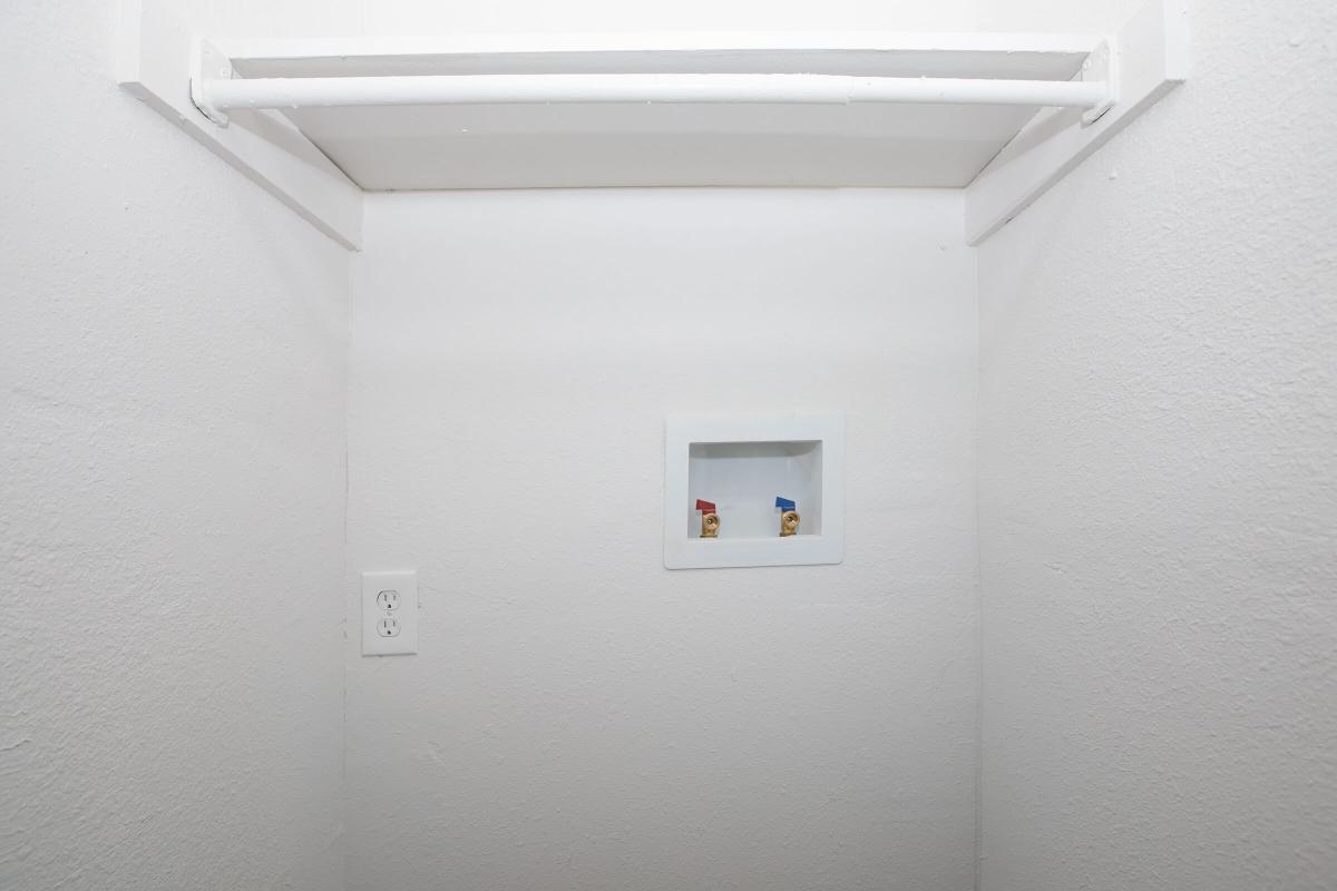 a white refrigerator freezer sitting in a room