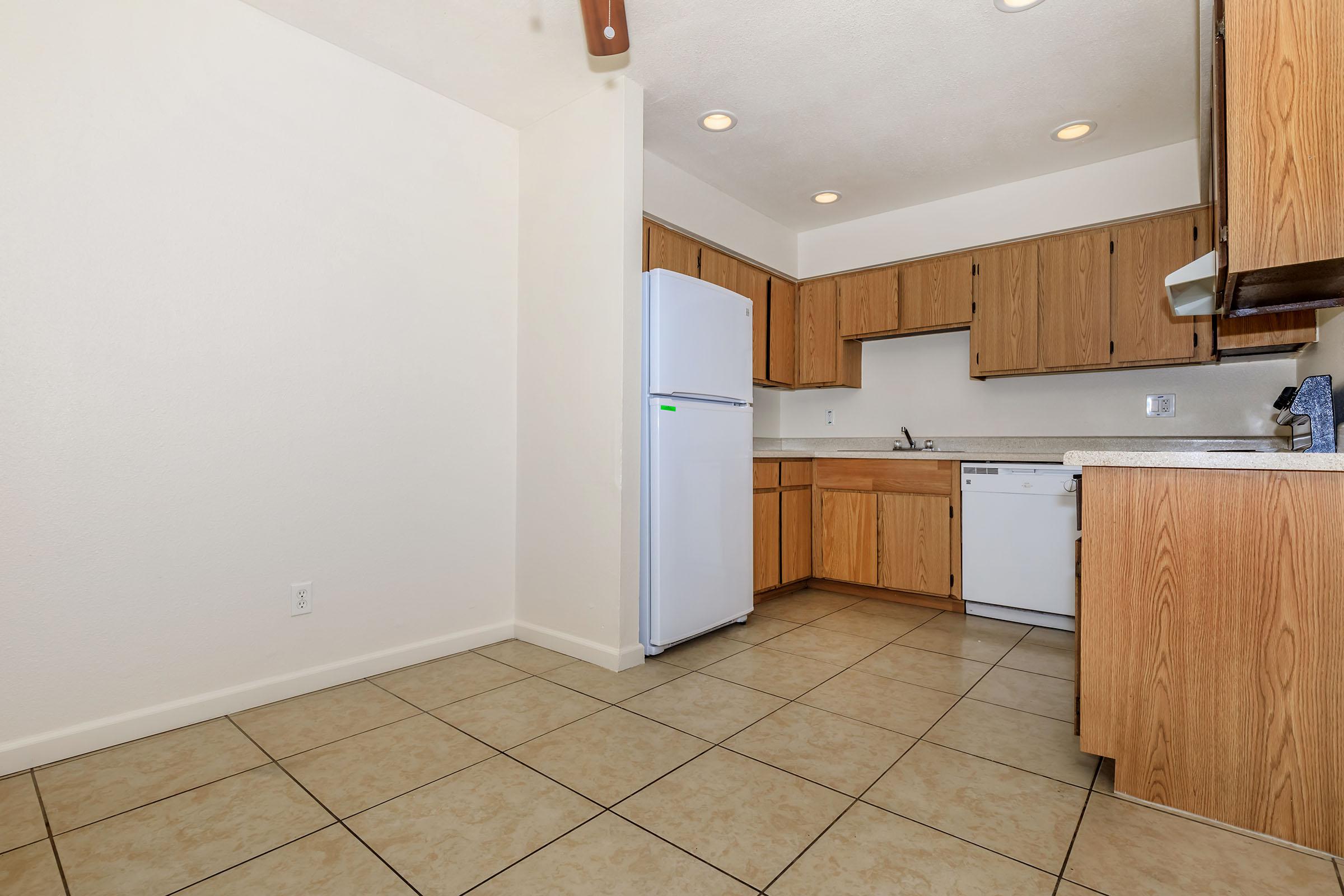 a kitchen with a wooden floor