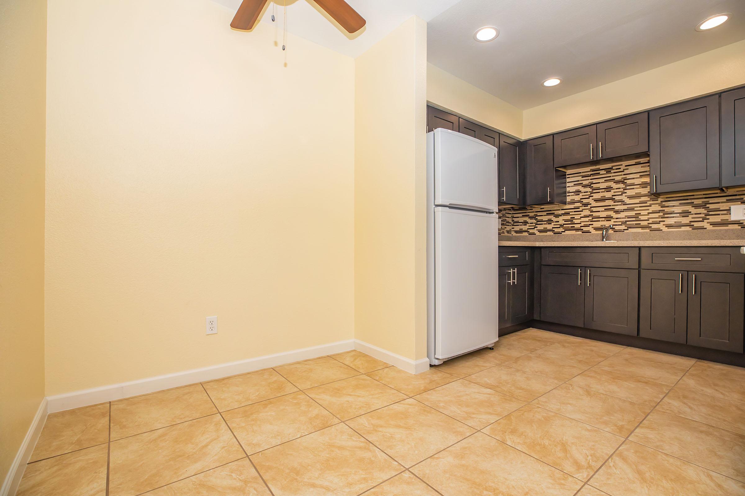 a kitchen with a tile floor