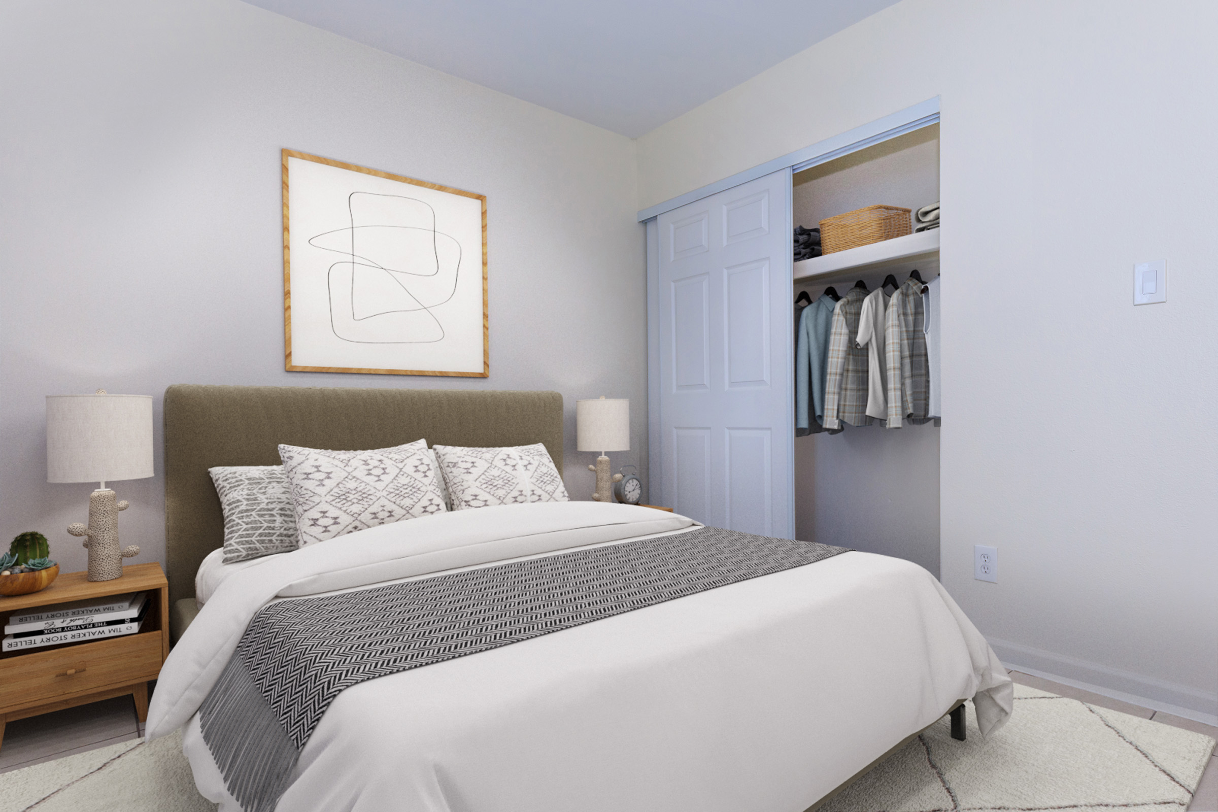 A cozy bedroom featuring a queen-sized bed with a light grey headboard, adorned with decorative pillows and a blanket. Nightstands with lamps on either side, a minimalist wall art piece above the bed, and a closet with neatly hung clothes and storage bins visible in the background. Soft, neutral color palette throughout.