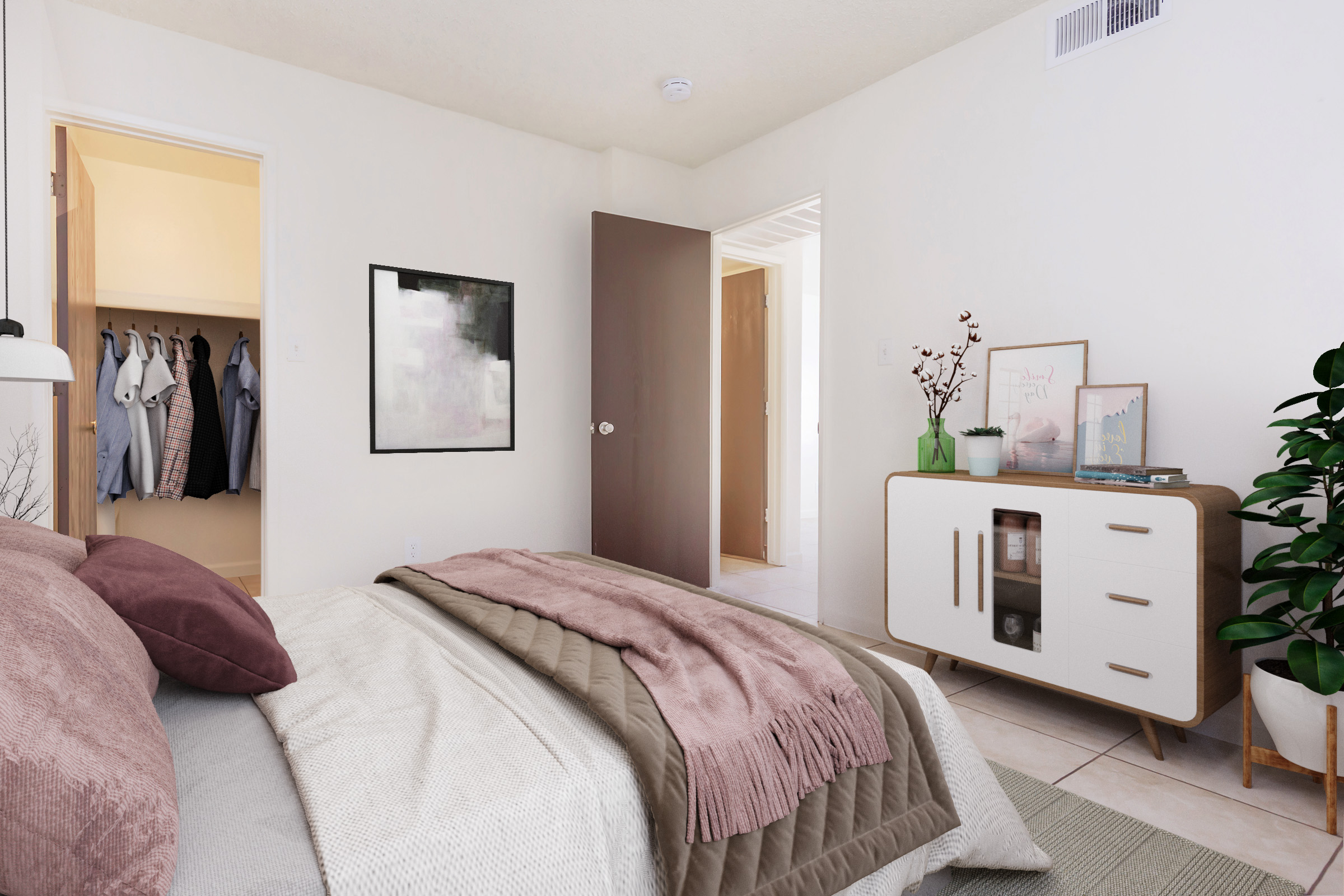 A cozy bedroom featuring a neatly made bed with decorative pillows and a textured blanket. A stylish nightstand with decor, a plant in the corner, and an open door leading to a closet. Light-colored walls and soft lighting create a warm and inviting atmosphere.