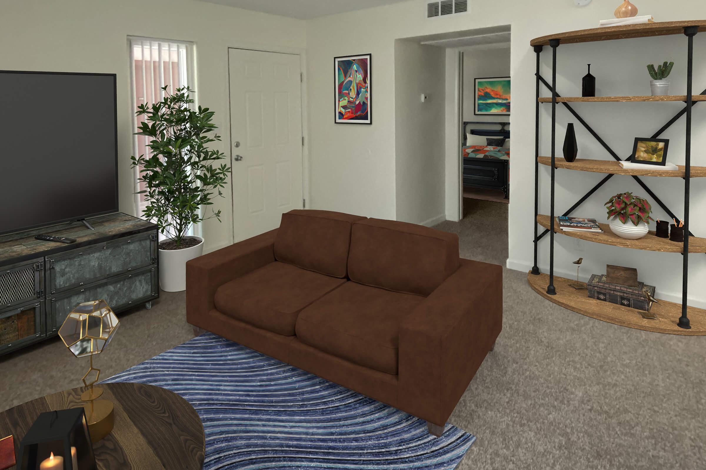 Living room featuring a brown couch on a blue area rug, a dark television console, and a decorative bookshelf. A potted plant adds greenery, while framed artwork adorns the walls. A doorway leads to another room, hinting at a cozy, inviting space. The overall design is modern and warm.